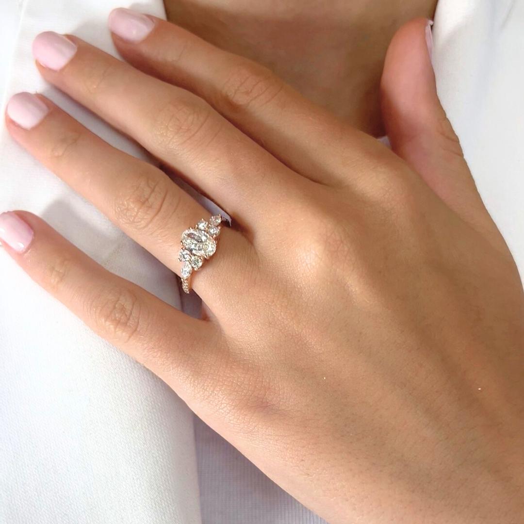 Dazzling 1.59ct Natural Diamonds Ring in 18k Rose Gold - IGI Certified

Softly romantic with a modern twist, this 18k rose gold ring centers around a luminous 1.00ct oval diamond, offering a graceful, elongated sparkle. Flanked by 2 marquise-cut