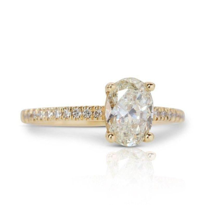 Embrace the captivating allure of this exquisite ring, showcasing a mesmerizing 1.51-carat oval brilliant diamond. This captivating centerpiece, meticulously cut to maximize its brilliance and fire, rests atop a radiant 18K yellow gold band,