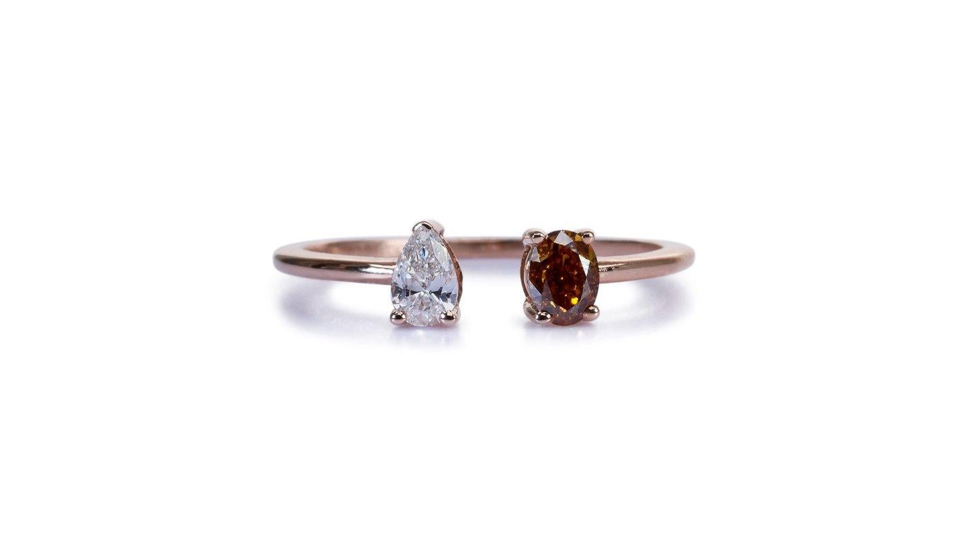 A stylish and elegant open ring with a dazzling 0.16 carat pear natural diamond. It has 0.27 carat of side diamonds which add more to its elegance. The jewelry is made of 18k Rose Gold with a high-quality polish. It comes with an AIG certificate and