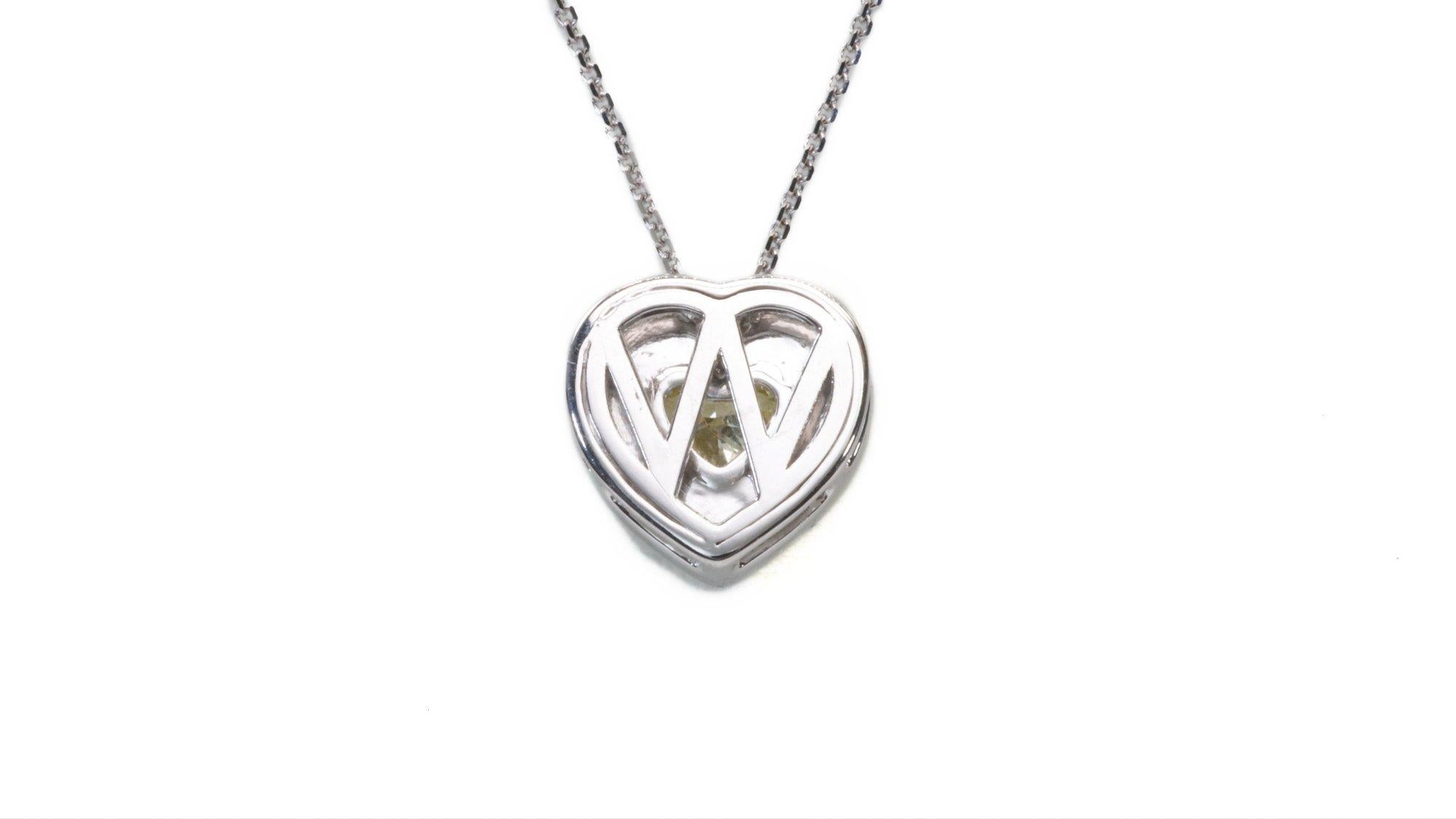 Beautiful Heart shape natural canary diamond mounted in a halo style pendent with 0.89 carat of ideal cut Diamonds made from  18k white gold diamond pendant with GIA certificate for the main stone and laser inscription.

-1 diamond main stones of