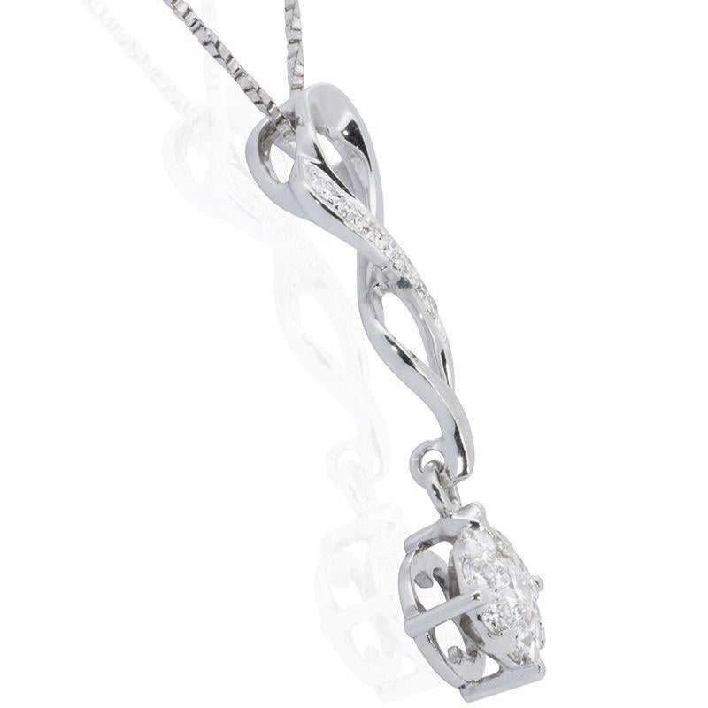 A beautiful pendant with a dazzling 0.08 carat round brilliant natural diamond. It has 0.31 carat of side diamonds which add more to its elegance. The jewelry is made of 18K White Gold with a high quality polish. It comes a fancy jewelry