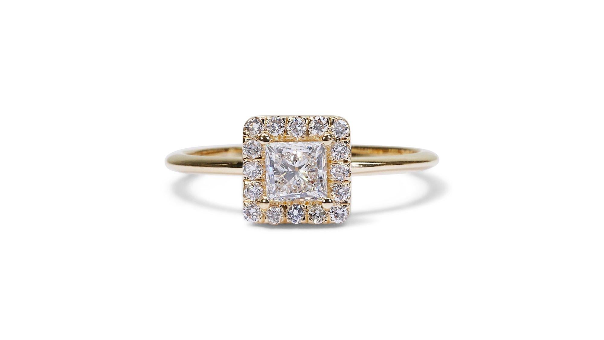 A beautiful Ring with a dazzling 0.5 carat Princess natural Diamond. It has 0.17 carat of side diamonds which add more to its elegance. The jewelry is made of 18k Yellow Gold with a high quality polish. It comes with AIG certificate and a fancy