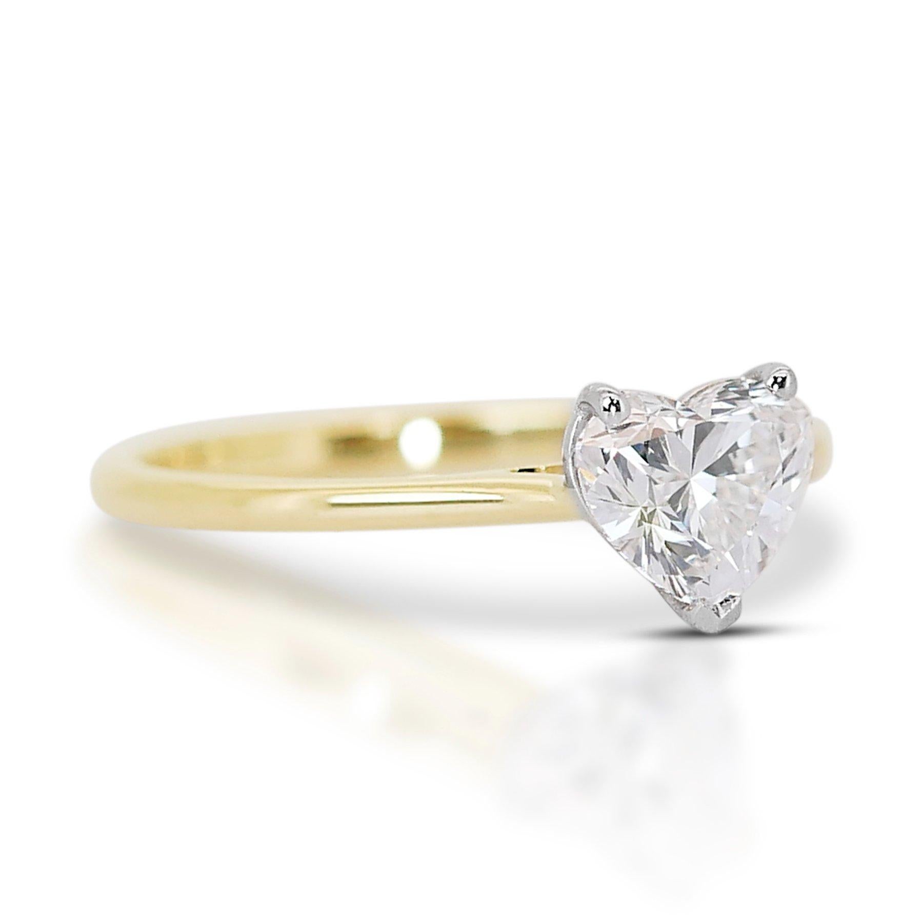 Dazzling 18K Yellow Gold Heart Design Natural Diamond Ring w/1.00ct 

This ring is a captivating symbol of love, featuring a dazzling 1.00 carat natural diamond in a romantic heart shape. The ring is crafted from luxurious 18K yellow gold, adding a