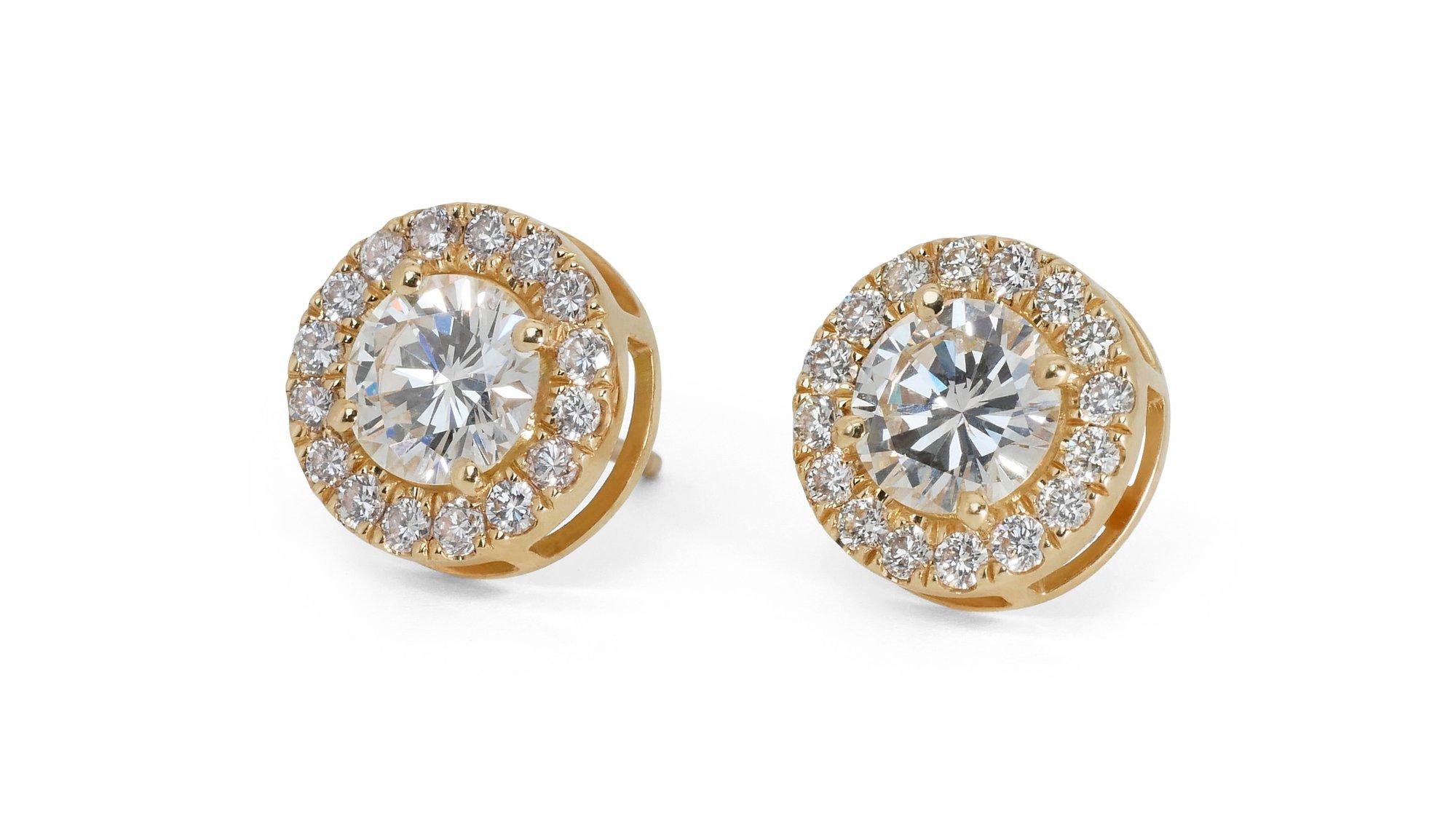 Dazzling 18k Yellow Gold Natural Diamond Halo Stud Earrings w/2.65 ct - GIA Certified

Be mesmerized by the captivating brilliance of these diamond halo stud earrings, meticulously crafted in 18k yellow gold. These stud earrings features a dazzling