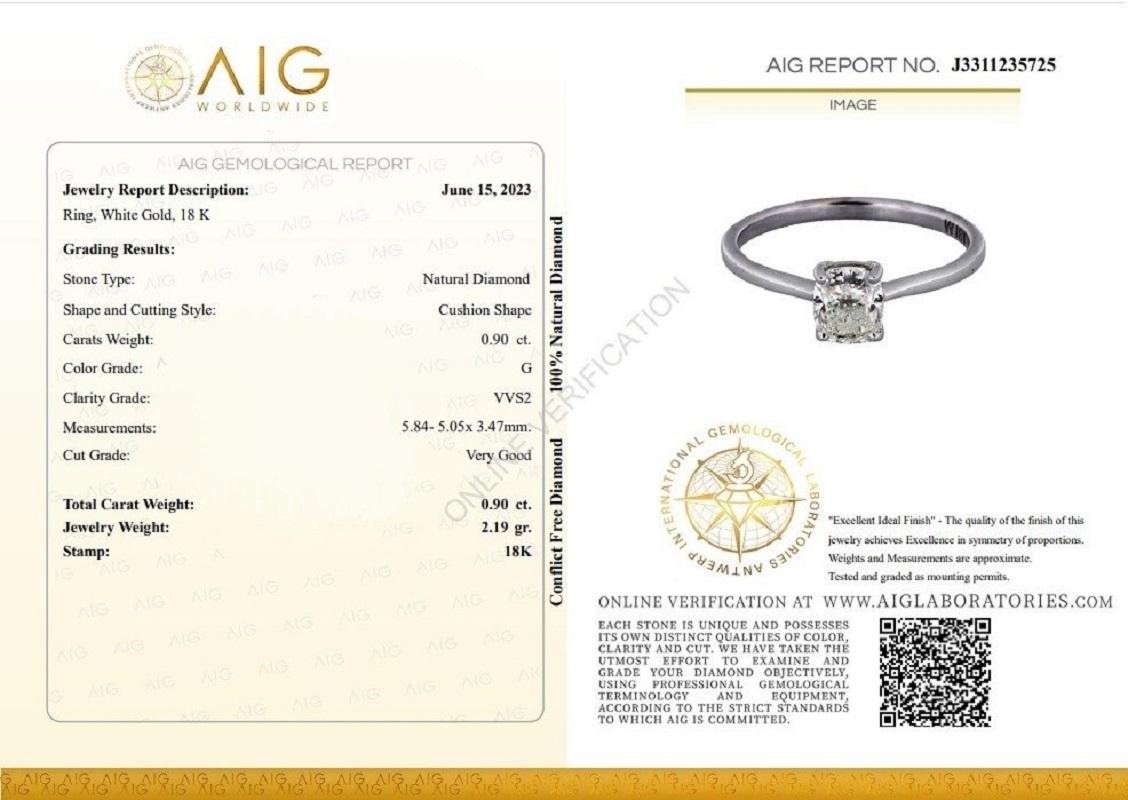 A simple yet stunning solitaire ring with a dazzling 0.9-carat cushion shape diamond. The jewelry is made of 18K White Gold with a high-quality polish. It comes with an AIG certificate and a nice jewelry box.

1 diamond main stone of 0.9 carat
cut: