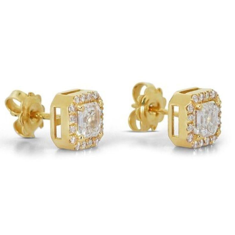 Embrace captivating brilliance with these mesmerizing earrings, each showcasing a breathtaking 1.01 carat asscher natural diamond. These radiant centerpieces, boasting the coveted G-H color and VVS1 clarity, radiate exceptional fire and geometric