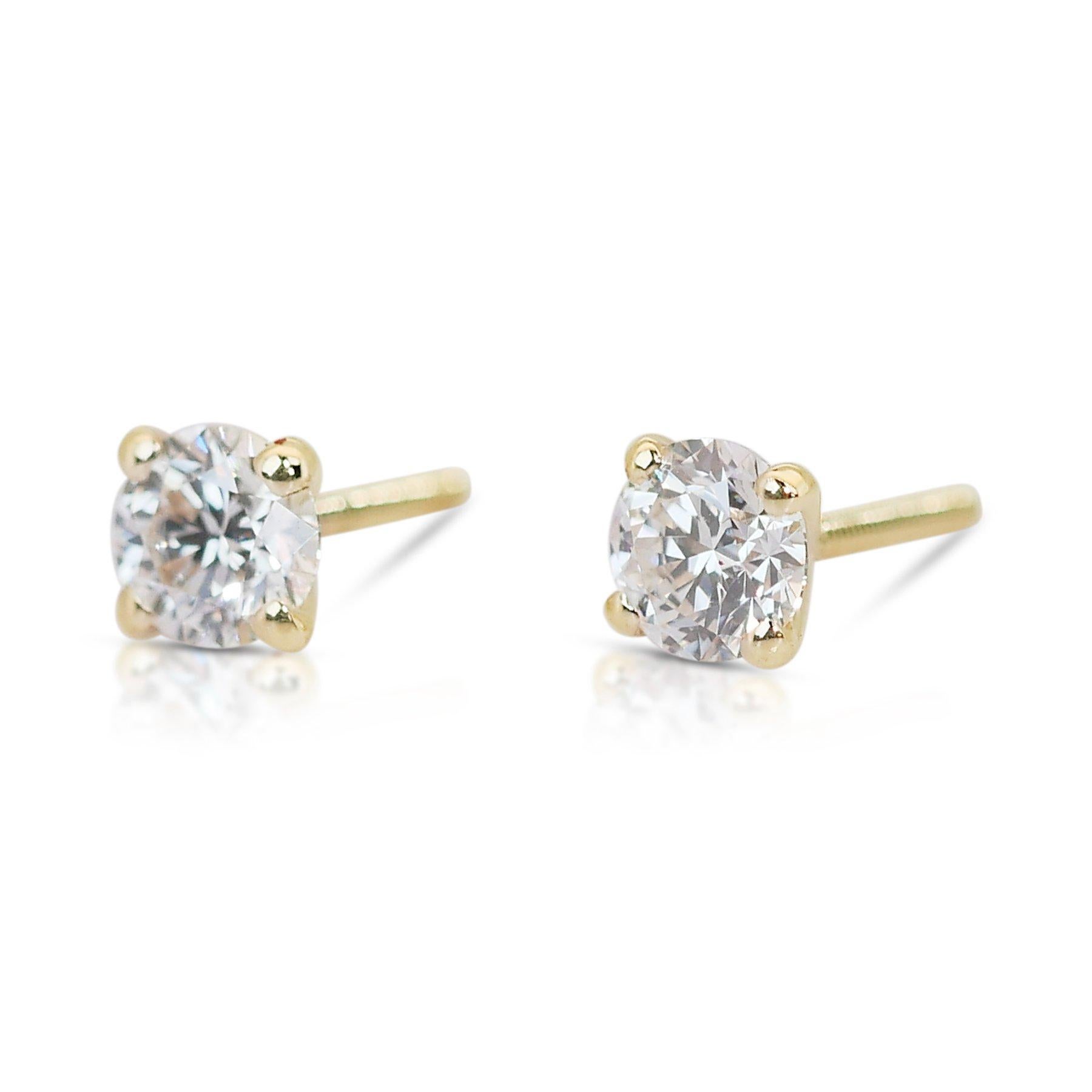 Dazzling 2.01ct Triple Excellent Ideal Cut Diamonds Stud Earrings in 14k Yellow Gold - GIA Certified

Indulge in timeless elegance with these stunning earrings, featuring two round-cut diamonds of triple excellent ideal cut for unmatched brilliance