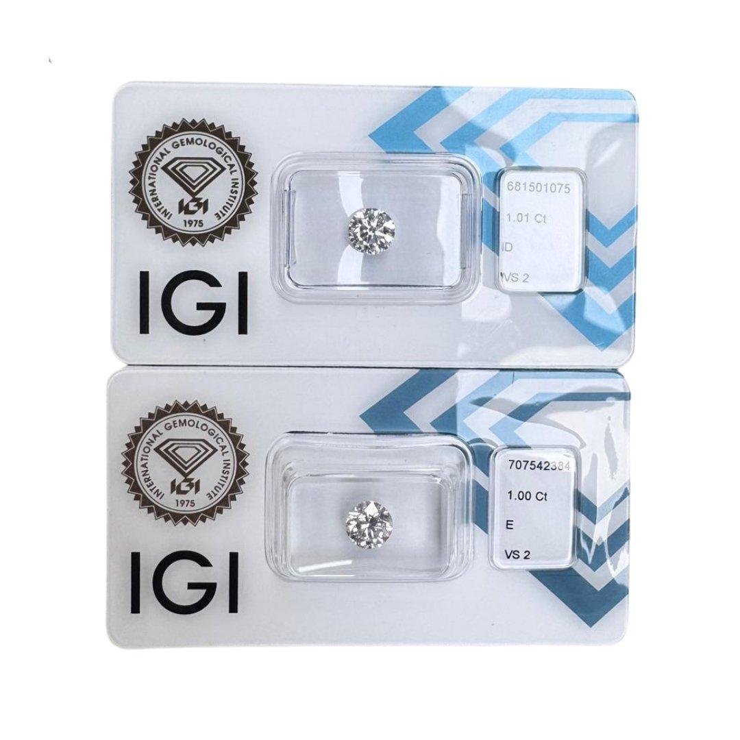 A remarkable diamond duo, these two round brilliant diamonds totaling 2.01ct are a perfect match in beauty and precision. Each stone boasts a triple excellent ideal cut, maximizing sparkle and symmetry. IGI certified and sealed in secure,