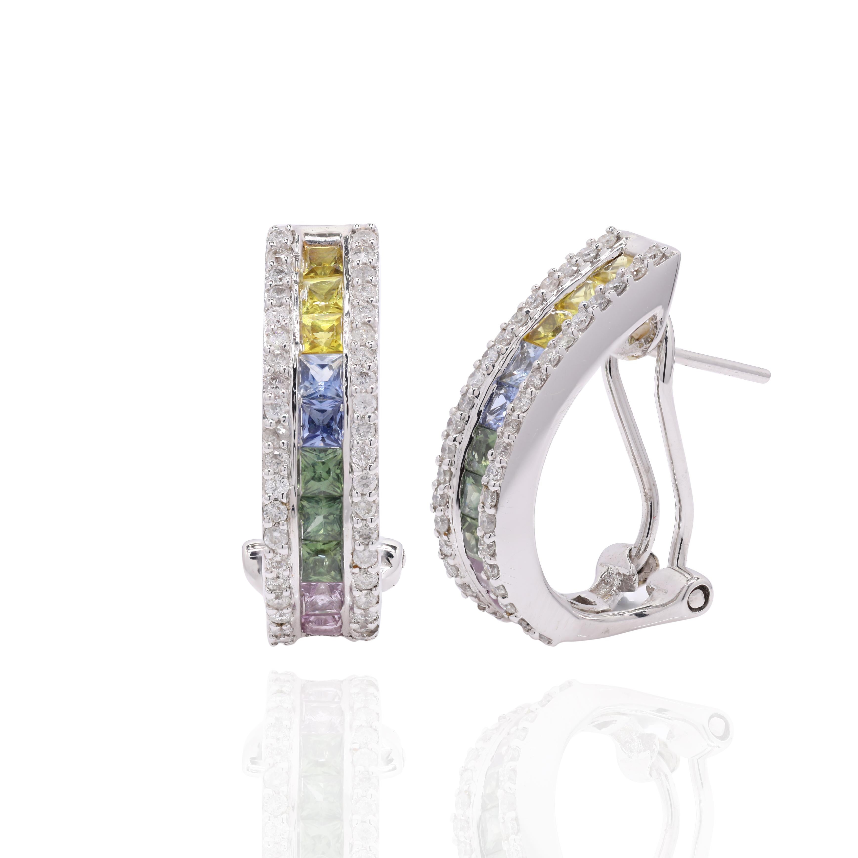 Diamond and Multi Colored Sapphire Clip On Earrings in 18K Gold. Earrings create a subtle beauty while showcasing the colors of the natural precious gemstones and illuminating diamonds making a statement.
Square cut multi sapphire studs with