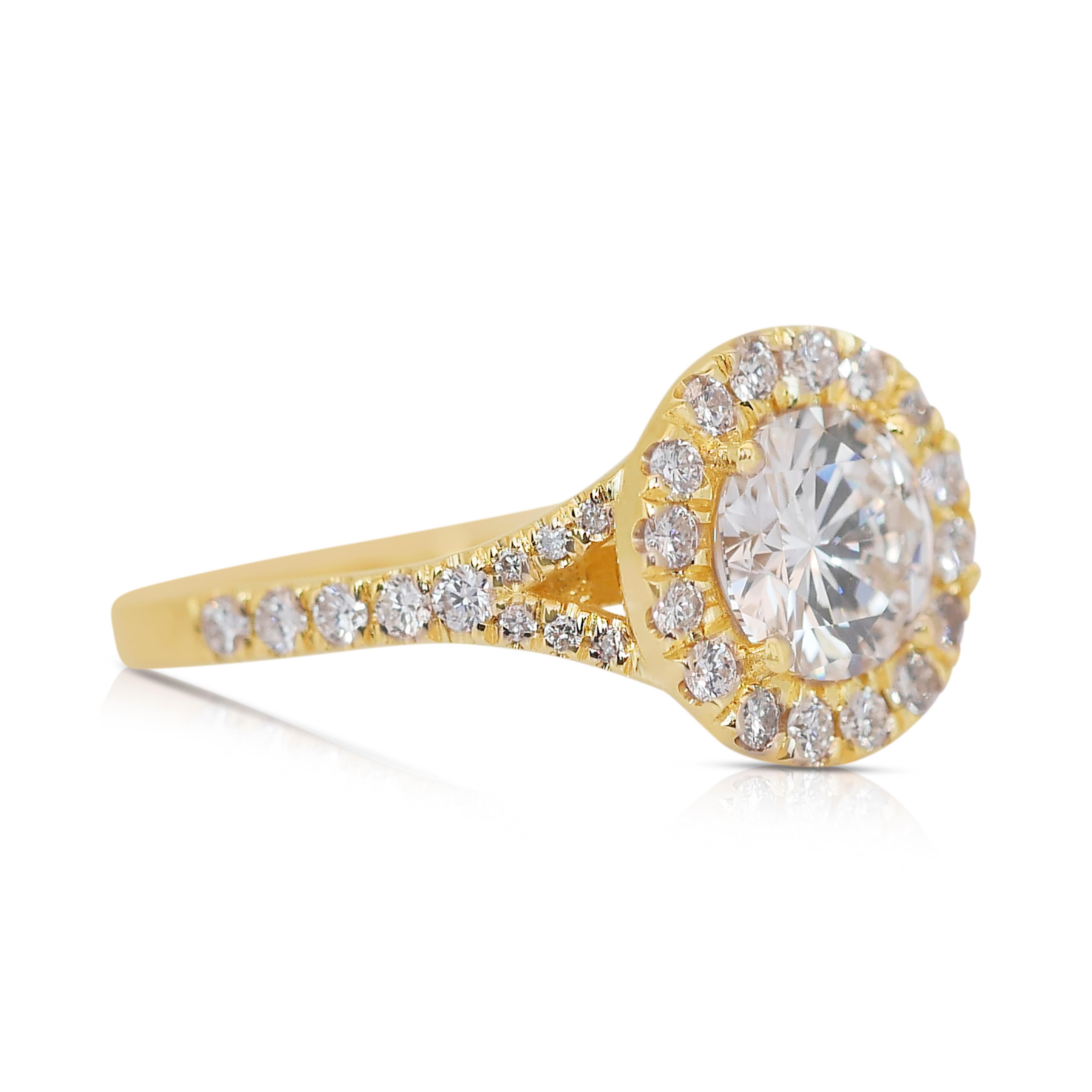 Dazzling 2.47ct Triple Excellent Ideal Cut Diamonds Halo Ring in 18k Yellow Gold - IGI Certified

Immerse yourself in luxury with this magnificent 18k yellow gold halo ring, featuring a brilliant 2.01ct round diamond as its centerpiece. This diamond