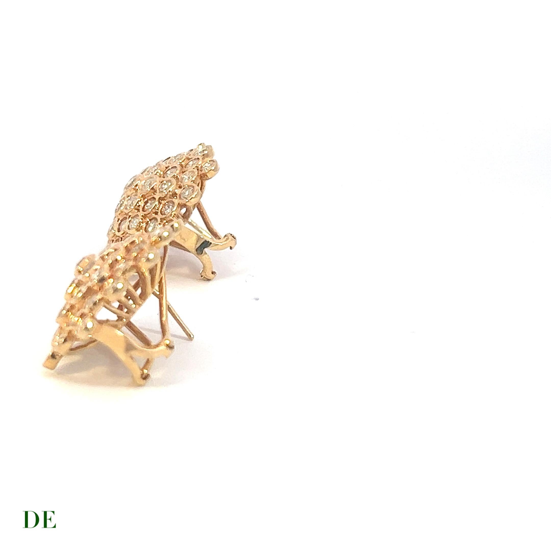 These amazing honeycomb earrings are a stunning piece of jewelry that exudes luxury and sophistication. The earrings feature 4.095 carats of natural diamonds that are set in 18K solid gold, creating a beautiful contrast against the yellow gold