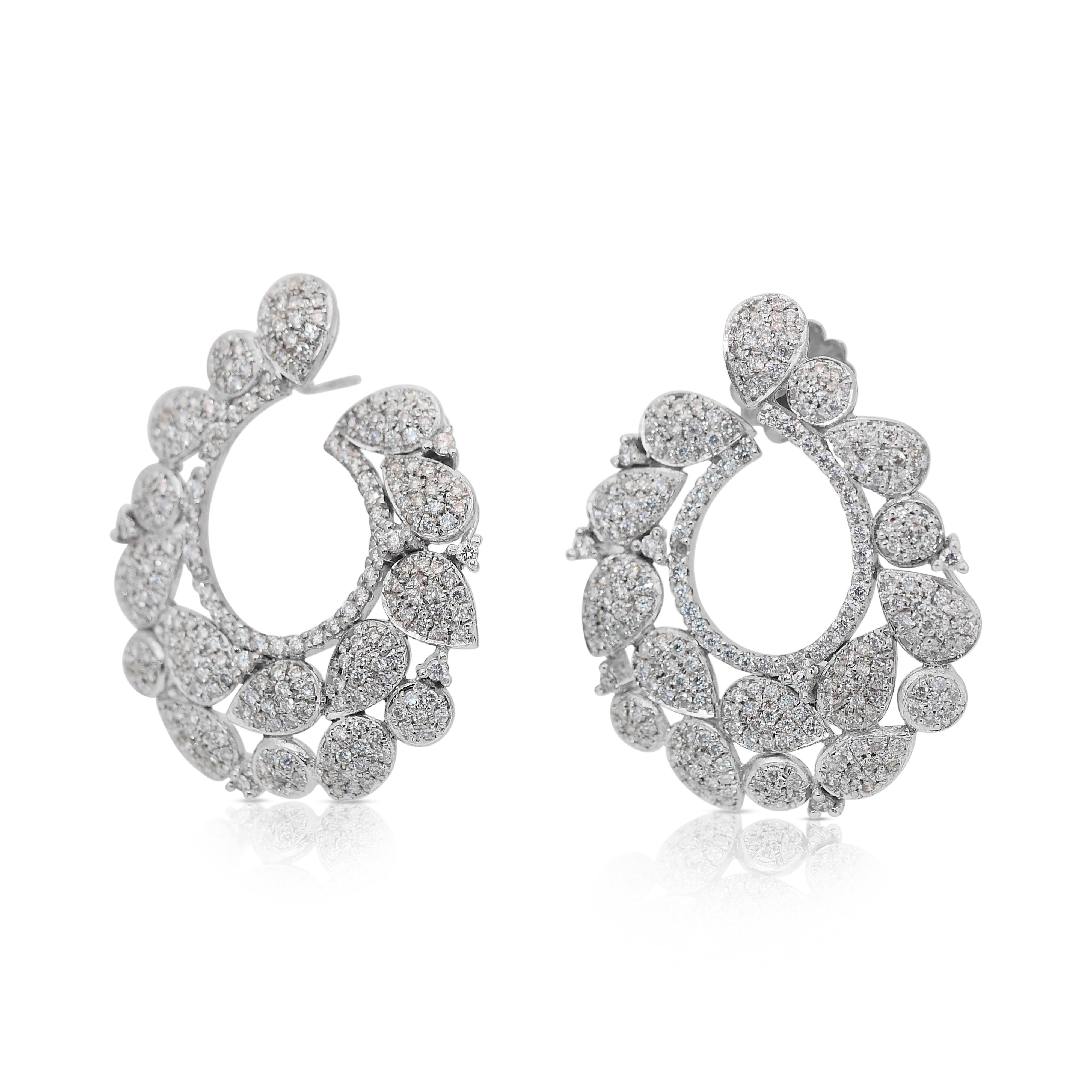 Dazzling 5.87ct Diamonds Earrings in 18k White Gold - IGI Certified

Elevate your elegance with these breathtaking 18k white gold diamond earrings, meticulously set with 614 round-cut diamonds totaling 5.87-carat. Showcasing an extraordinary color