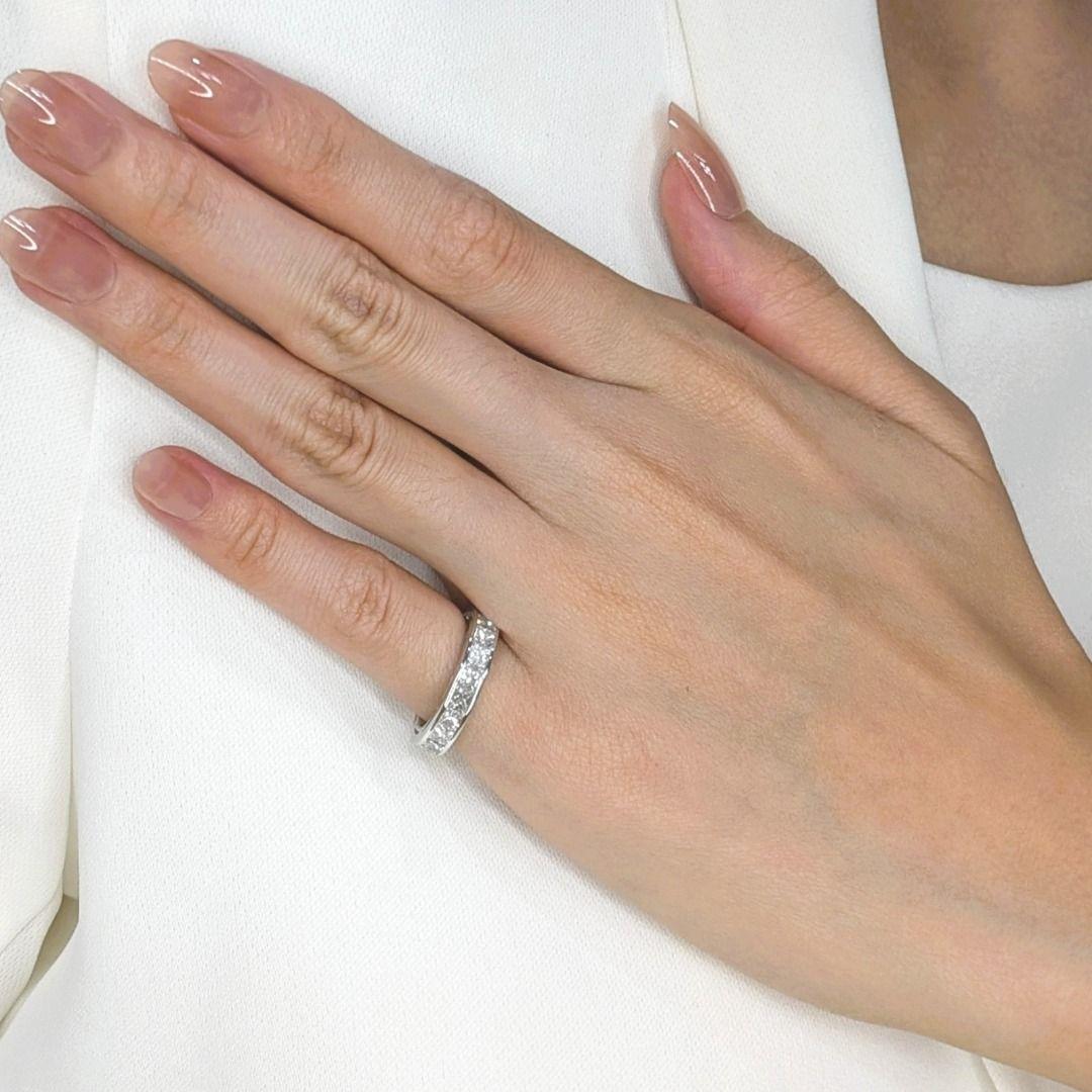 You simply have to see this ring! Imagine slipping on this radiant platinum band, its cool, smooth feel a delightful contrast to the dazzling brilliance of the 20 princess cut diamonds. Each stone, meticulously selected for its F-H color and VVS-VS