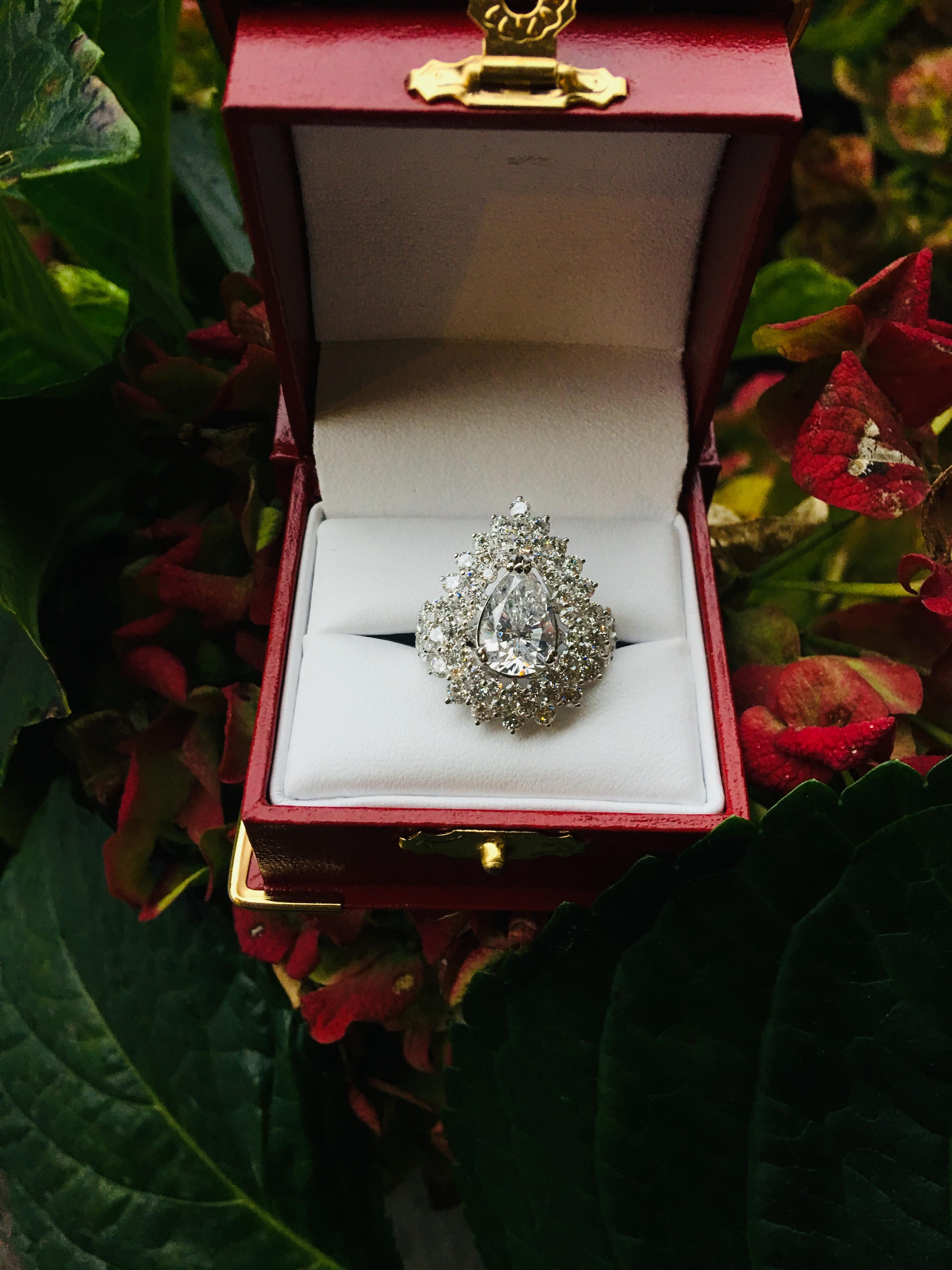 Dazzling 6.13 Carats F Color Diamond Ring with 2.63 Carat Pear Center 18 Karat In Excellent Condition In Tustin, CA