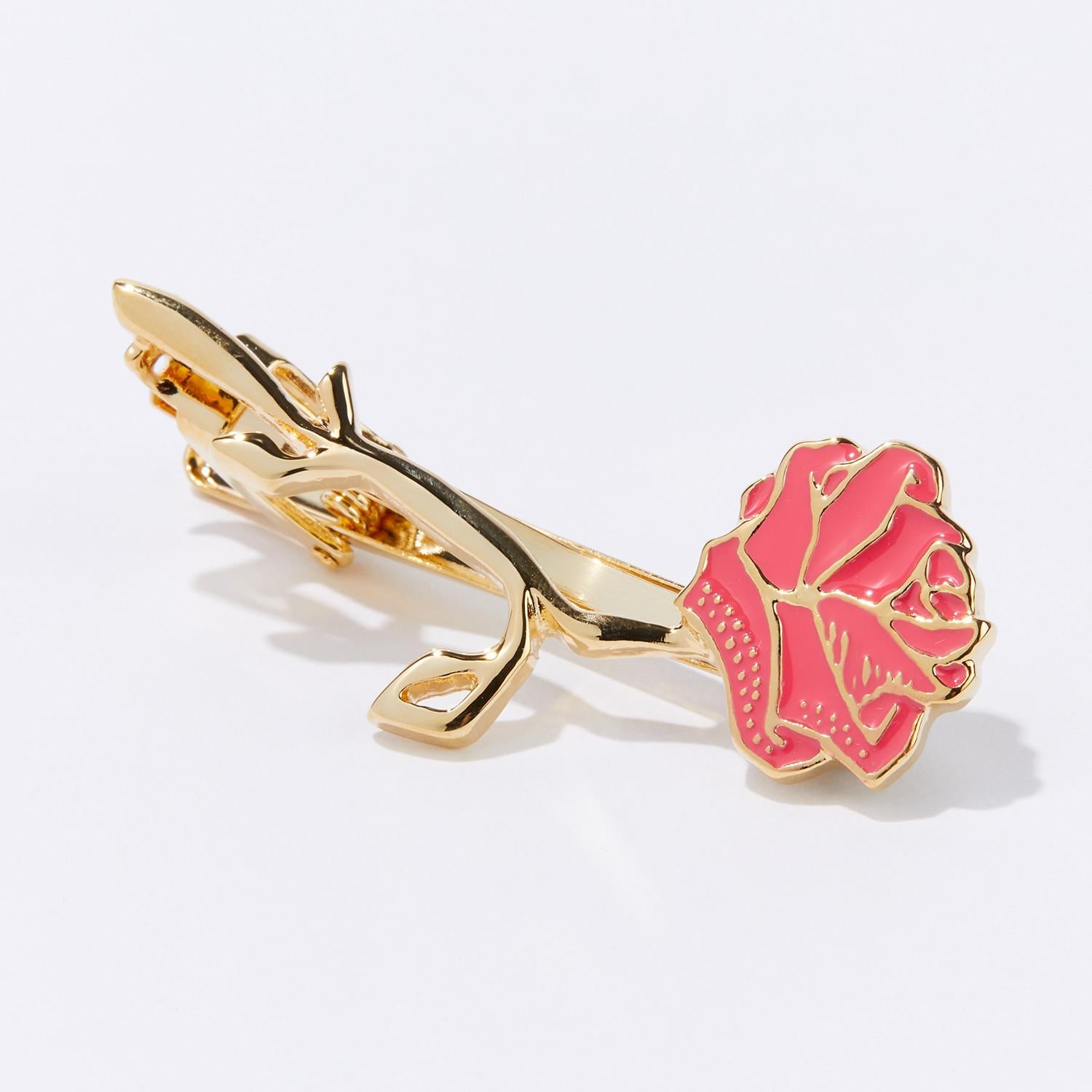 Celebrate all year long with our Dazzling Birthday Surprise Eternal Tie Clip. This hand-crafted floral treasure artfully replicates nature’s perfection with a passionately pink rosebud and our signature gold flower stem. Show your loved ones your