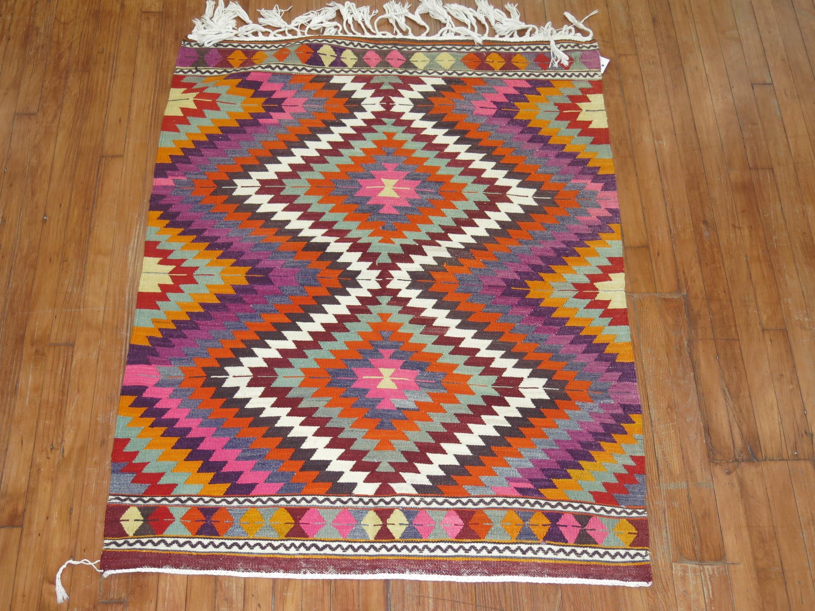 Colorful hand knotted mid-20th century Turkish Kilim in excellent condition

Measures: 3'9'' x 4'11''.