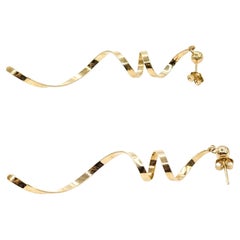 Orecchini a forma di vortice in oro giallo 14k