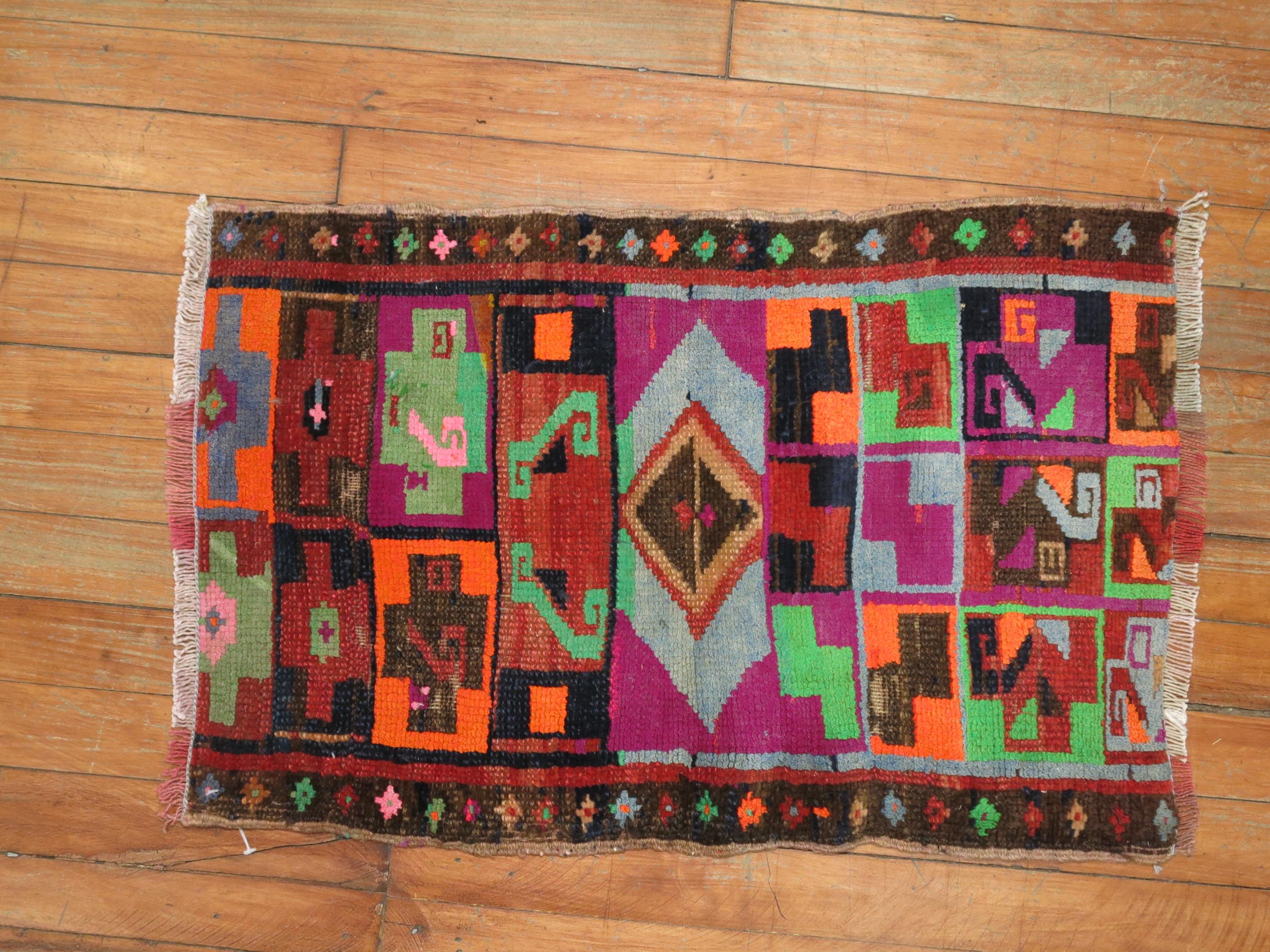 One of a kind vintage Turkish mat from the 20th century. All you got to do is Look at the colors ! Fun Rug

Measures: 1'5'' x 2'2''.