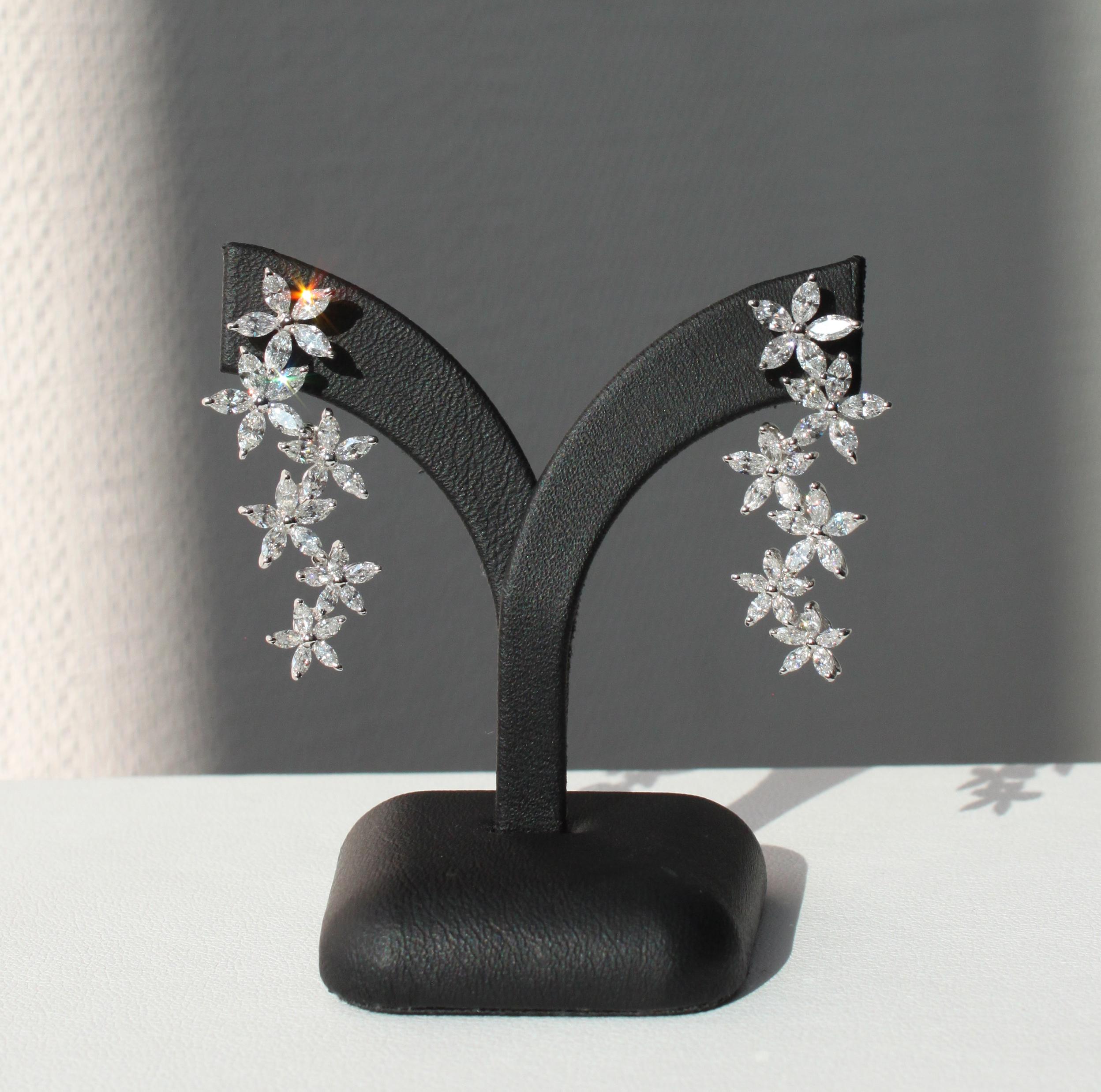 18K white gold
3.40ct natural marquise VS-SI diamonds
Total earring weight 6.42 g

Crafted with unparalleled artistry, these captivating earrings are a testament to exquisite craftsmanship. Fashioned in lustrous 18K white gold, their unique floral
