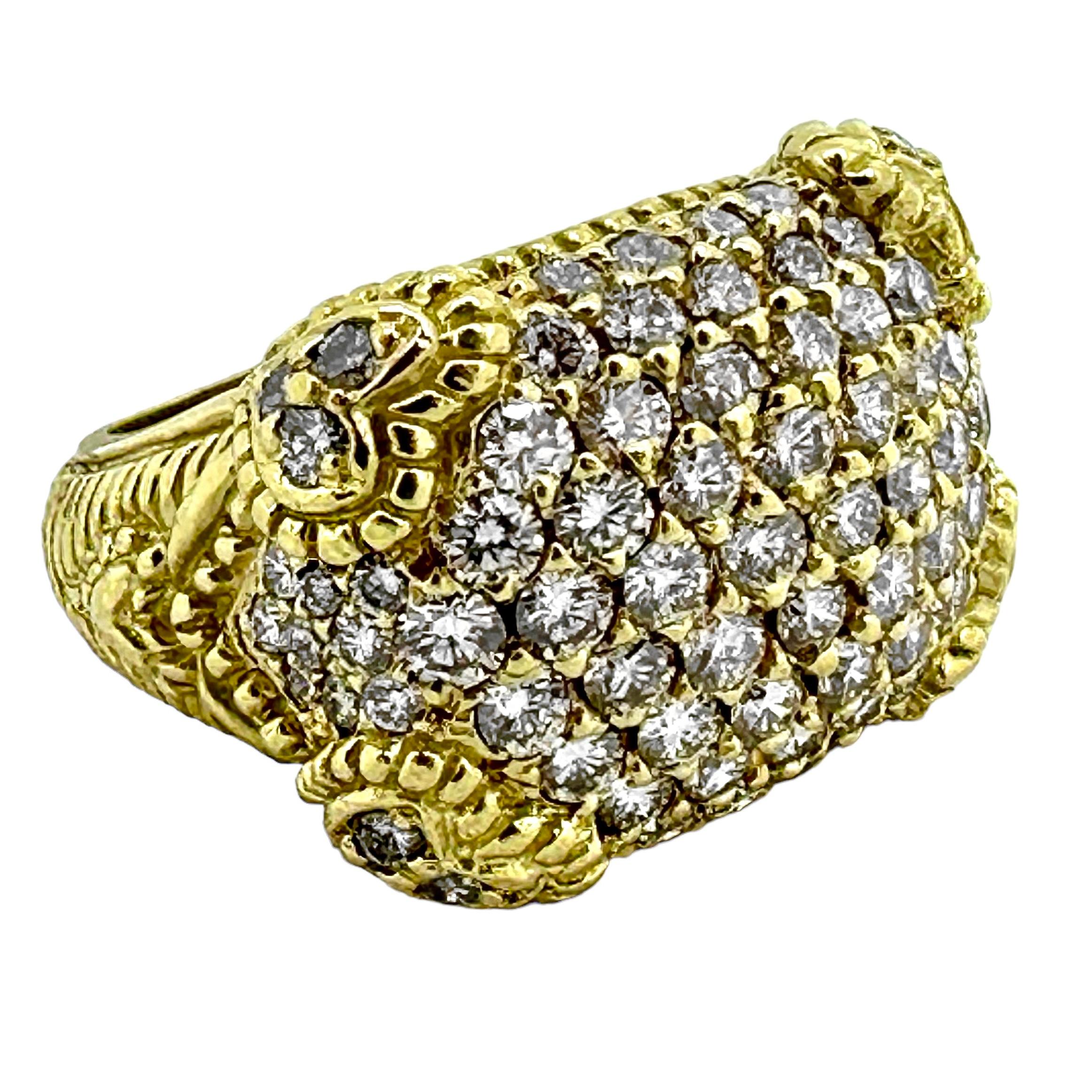 This wonderful late 20th-Century, 18k yellow gold Judith Ripka Classic Revival style cocktail ring truly does dazzle.
The entire 7/8 inch by 5/8 inch design area is pave set with eighty brilliant cut diamonds, having a total approximate weight of