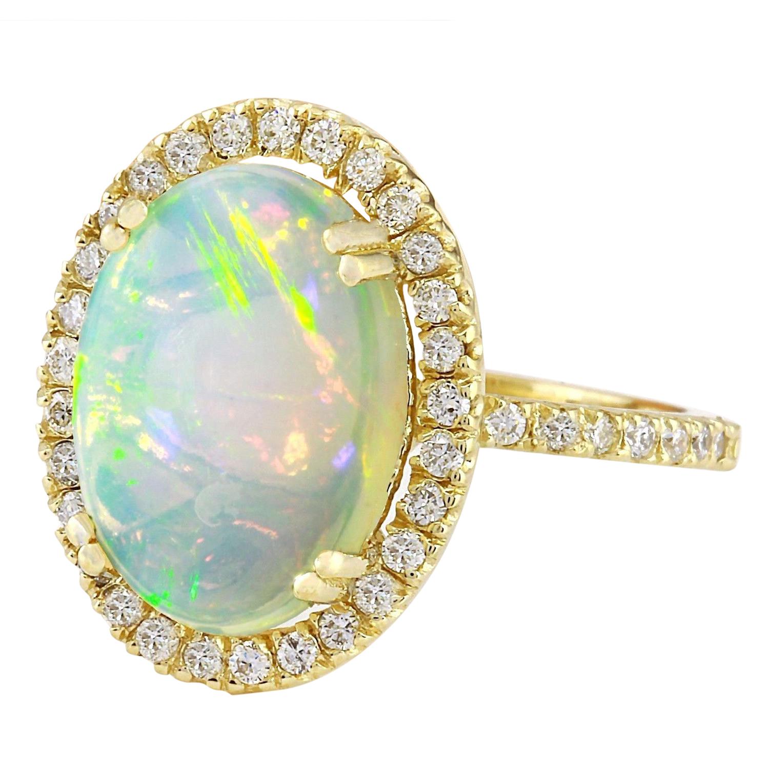 Introducing our captivating 14K Solid Yellow Gold Diamond Ring, featuring a mesmerizing 3.60 Carat Natural Opal centerpiece. Crafted with exquisite detail and elegance, this ring exudes sophistication and charm. The opal, weighing 3.10 Carats and
