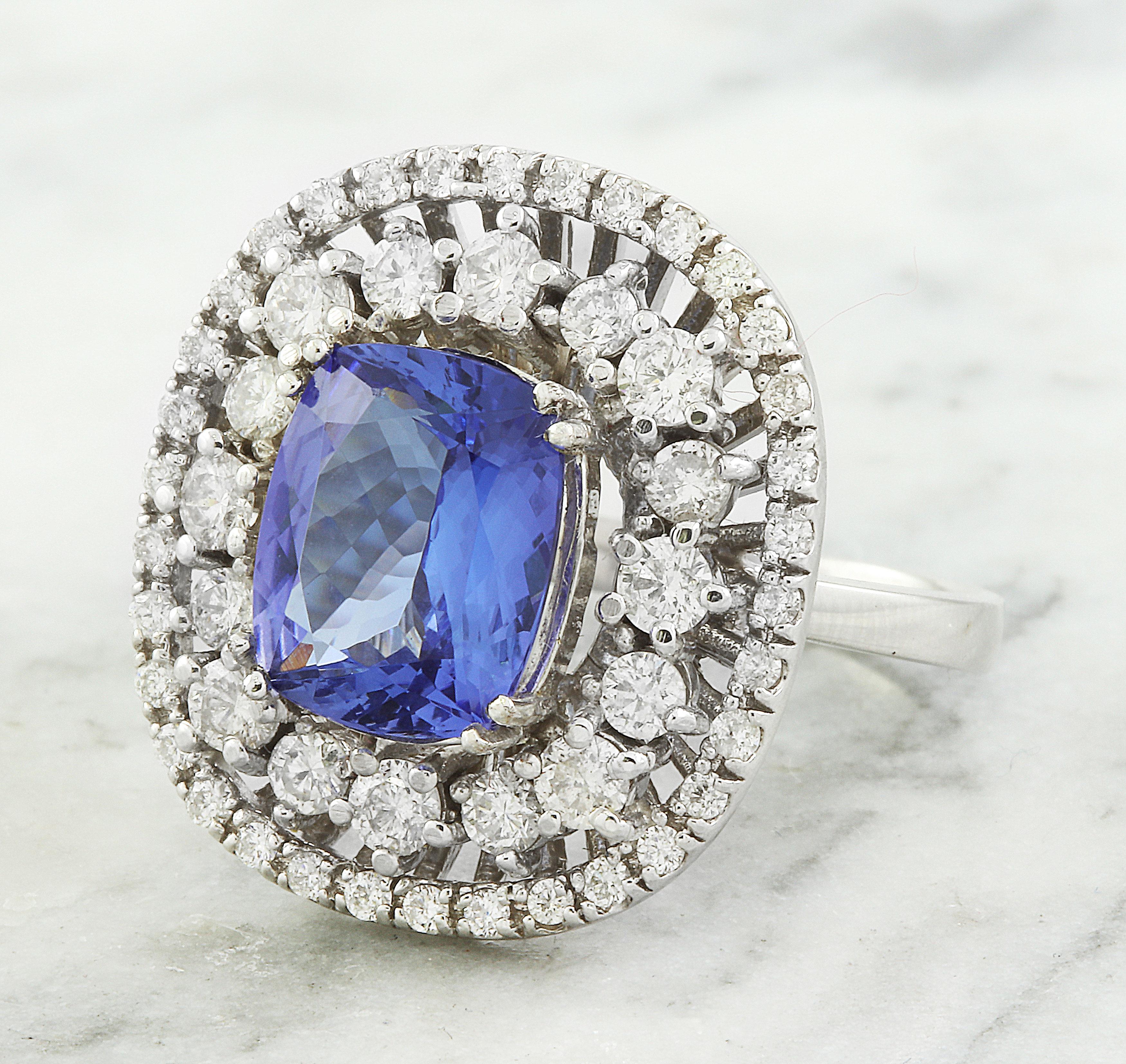 Indulge in luxury with our 5.20 carat natural tanzanite diamond ring in 14K solid white gold. Featuring a striking 4.00 carat tanzanite and 1.20 carats of diamonds, this ring exudes elegance. With a total weight of 7.7 grams and a face measuring