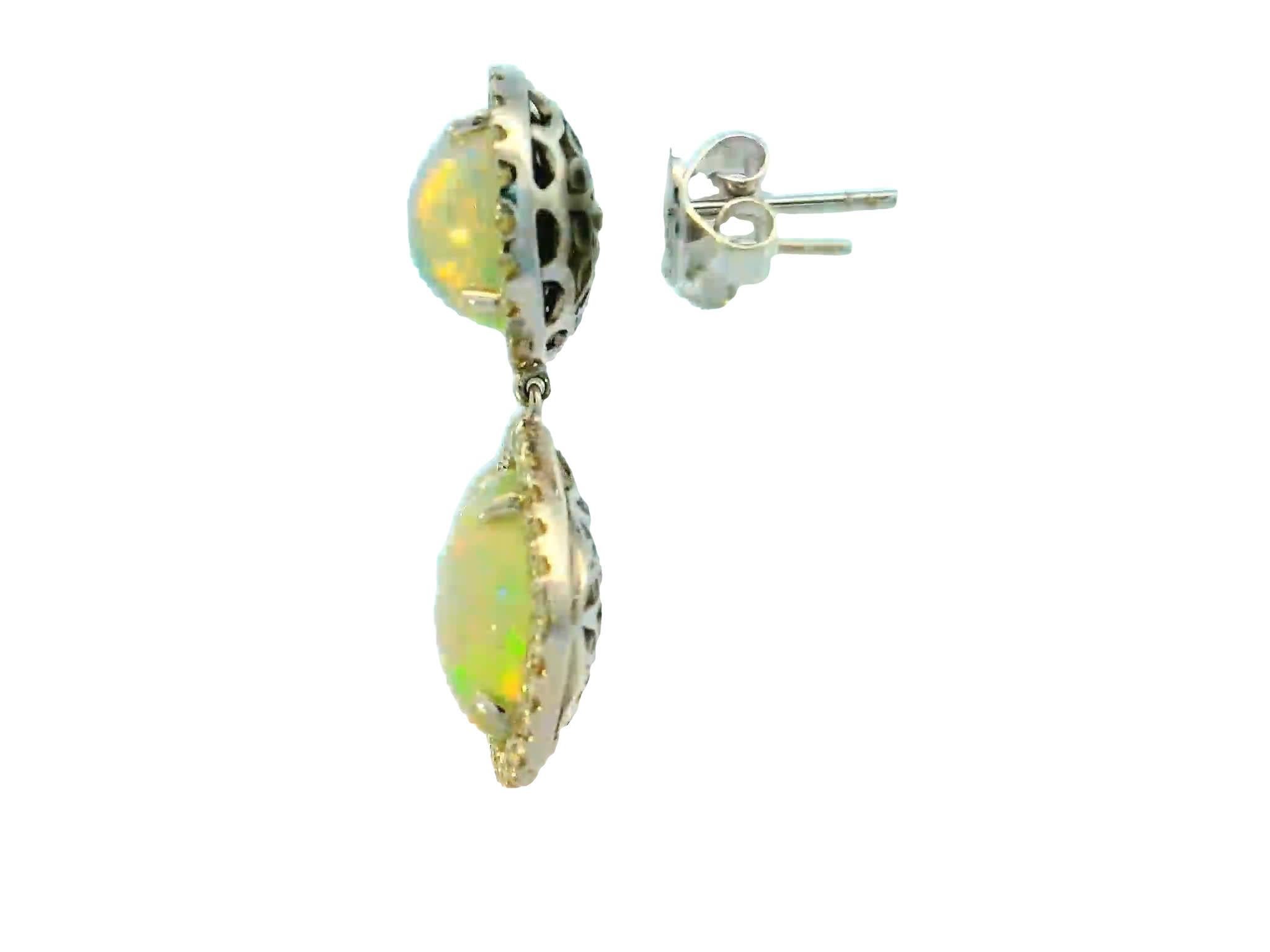 Introducing our exquisite collection of Opal 8.18CT and Diamond Earrings 1.10CT - the epitome of elegance and sophistication. $9738 MSRP
