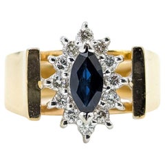 Ring mit schillerndem Saphir und Diamant in 14k Gelbgold mit Halo