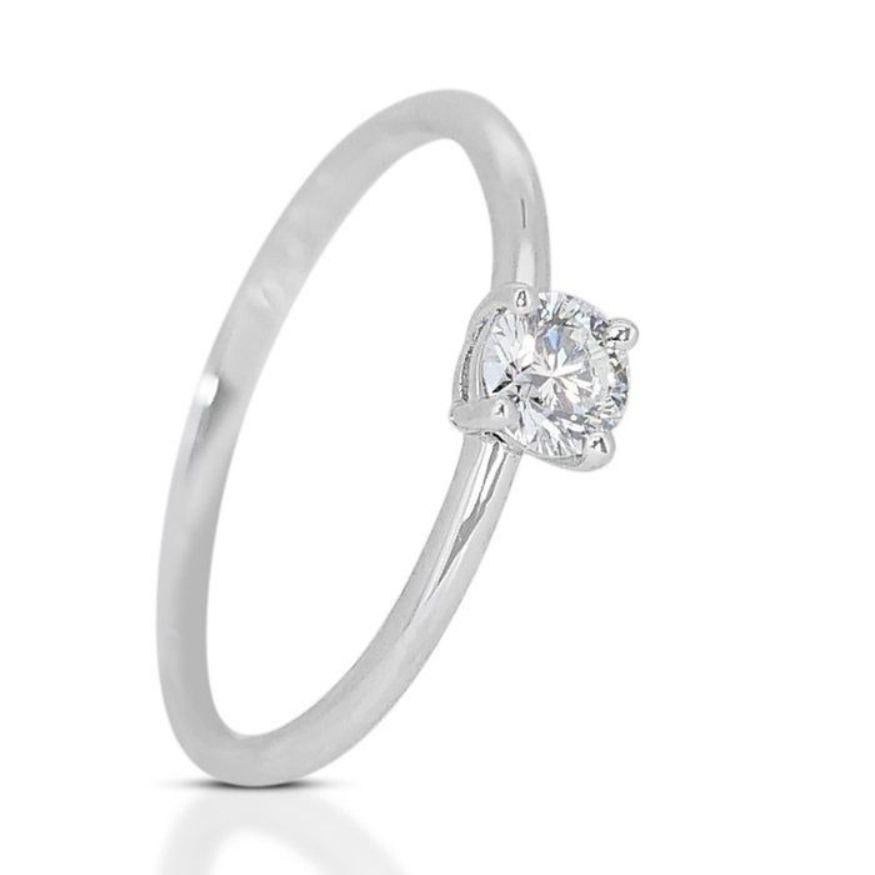 Round Cut Dazzling Solitaire Diamond Ring set in 18K White Gold