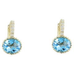 Boucles d'oreilles éblouissantes en topaze et diamant : Elegance luxueuse en or jaune massif 14K