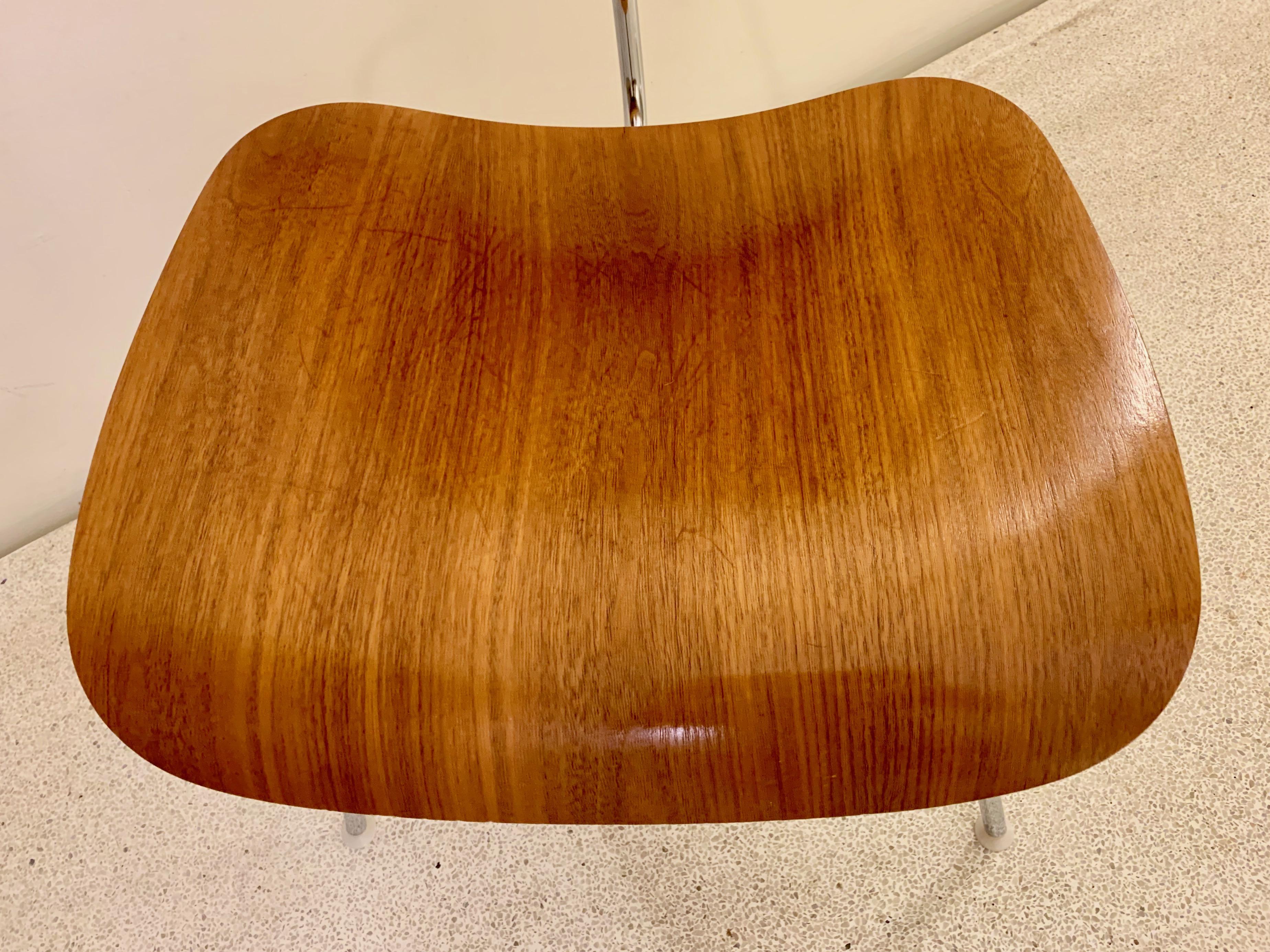 Walnut plywood on chrome frame dining chair metal. Manufactured by Herman Miller. This chair has been part of the VIPP showroom in New York and was later shipped with the VIPP family to their private residence in Dragør Copenhagen. We have four if