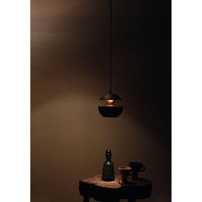 DCW Editions Here Comes the Sun 175 Pendant Lamp in Black Copper Aluminium by Bertrand Balas
 
 Bertrand Balas, architect born in Toulouse in 1935 likes to watch the sun set over the Garonne river. With that musical lilt typical of the south, he