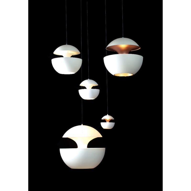 DCW Editions Here Comes the Sun 250 Pendant Lamp in White Pink Copper Aluminium by Bertrand Balas
 
 Bertrand Balas, architect born in Toulouse in 1935 likes to watch the sun set over the Garonne river. With that musical lilt typical of the south,