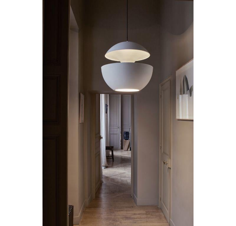 DCW Editions Here Comes the Sun 450 Pendant Lamp in White Aluminium by Bertrand Balas
 
 Bertrand Balas, architect born in Toulouse in 1935 likes to watch the sun set over the Garonne river. With that musical lilt typical of the south, he likes to