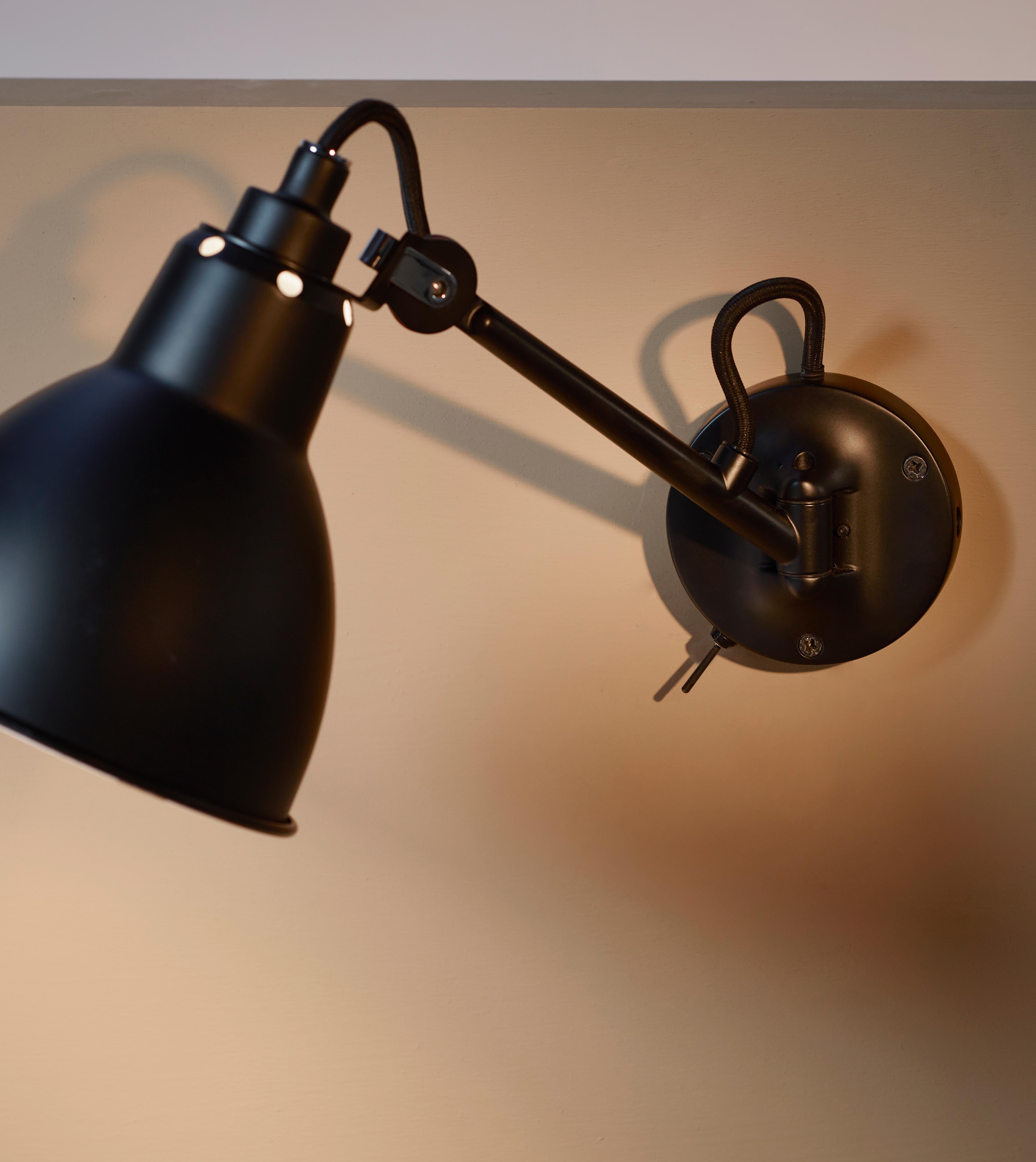 DCW Editions La Lampe Gras N°104 SW Wall Lamp in Black Steel Arm and Black Shade by Bernard-Albin Gras
 
 In 1921 Bernard-Albin GRAS designed a series of lamps for use in offices and in industrial environments. The GRAS lamp, as it was subsequently