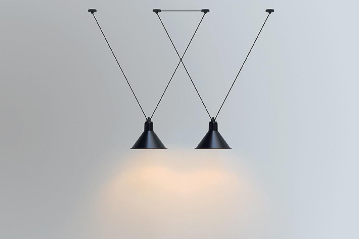 DCW Editions Les Acrobates N°323 AC1 AC2 Large Conic Pendant Lamp in Black Steel Arm and Black Copper Shade by Bernard-Albin Gras
 
 Les Acrobates de GRAS are adept at doing tricks high in the air, way above the ground. The high wire flyers (Nº323,