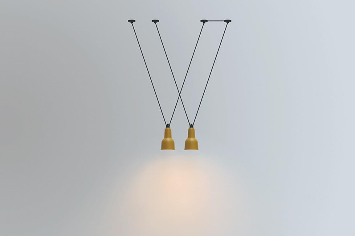 DCW Editions Les Acrobates N°323 AC1 AC2 Oculist Pendant Lamp in Black Steel Arm and Black Shade by Bernard-Albin Gras
 
Les Acrobates de GRAS are adept at doing tricks high in the air, way above the ground. The high wire flyers (Nº323, Nº324,