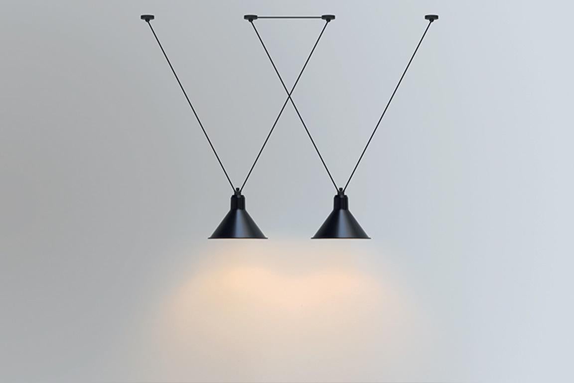 DCW Editions Les Acrobates N°323 AC1 AC2 XL Conic Pendant Lamp in Black Steel Arm and Blue Shade by Bernard-Albin Gras
 
Les Acrobates de GRAS are adept at doing tricks high in the air, way above the ground. The high wire flyers (Nº323, Nº324,