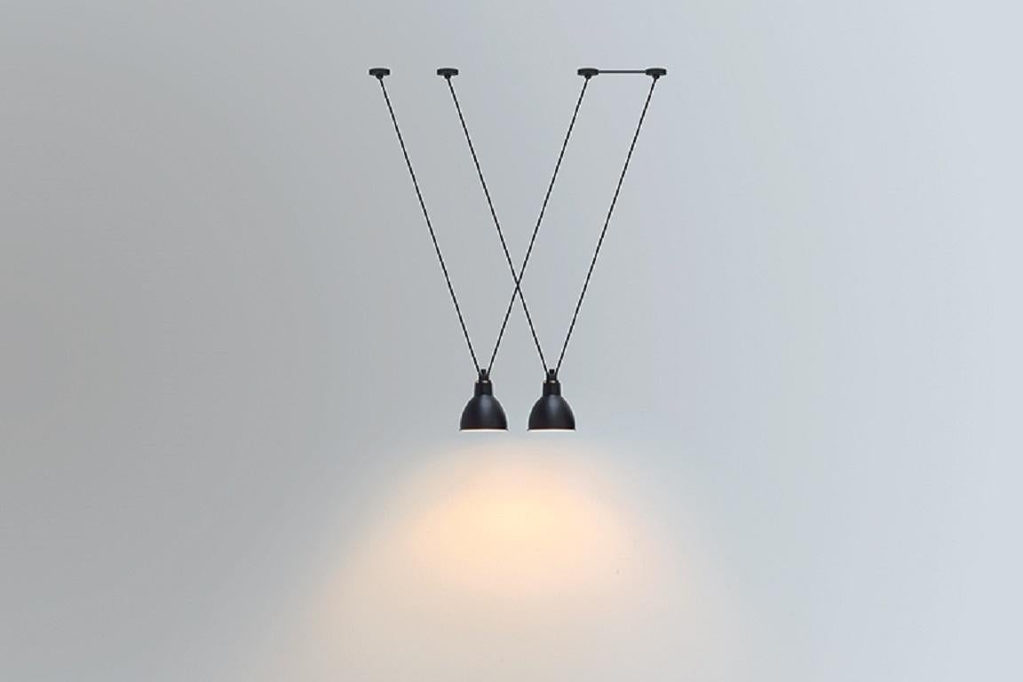 DCW Editions Les Acrobates N°323 AC1 AC2 XL Round Pendant Lamp in Black Steel Arm and Black Shade by Bernard-Albin Gras
 
 Les Acrobates de GRAS are adept at doing tricks high in the air, way above the ground. The high wire flyers (Nº323, Nº324,