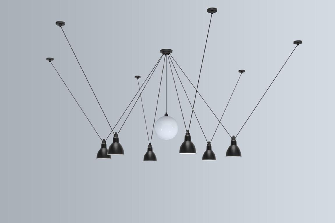 DCW Editions Les Acrobates N°327 Large Round Pendant Lamp in Black Steel Arm, Black Shade and Glassball 175 by Bernard-Albin Gras
 
 Les Acrobates de GRAS are adept at doing tricks high in the air, way above the ground. The high wire flyers (Nº323,