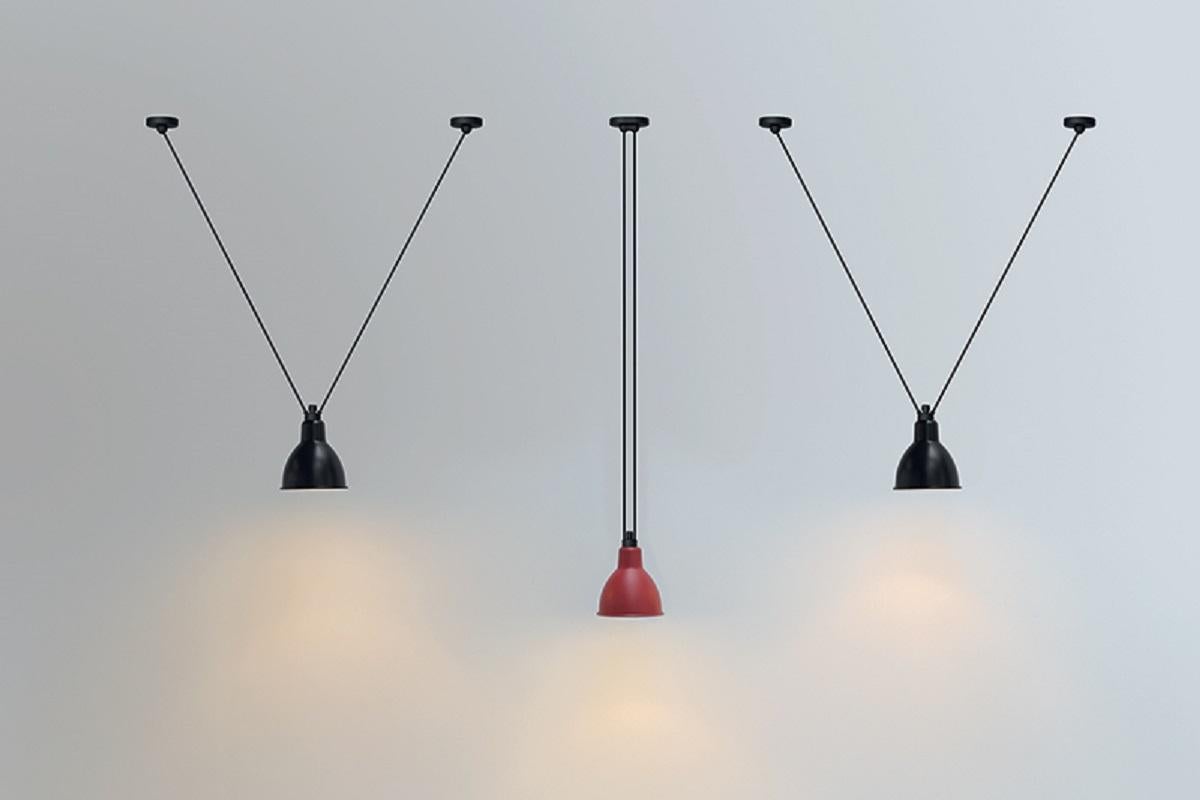 DCW Editions Les Acrobates Nº322 Large Round Pendant Lamp in Black Steel Arm and Red Shade by Bernard-Albin Gras
 
 Les Acrobates de GRAS are adept at doing tricks high in the air, way above the ground. The high wire flyers (Nº323, Nº324, Nº325,