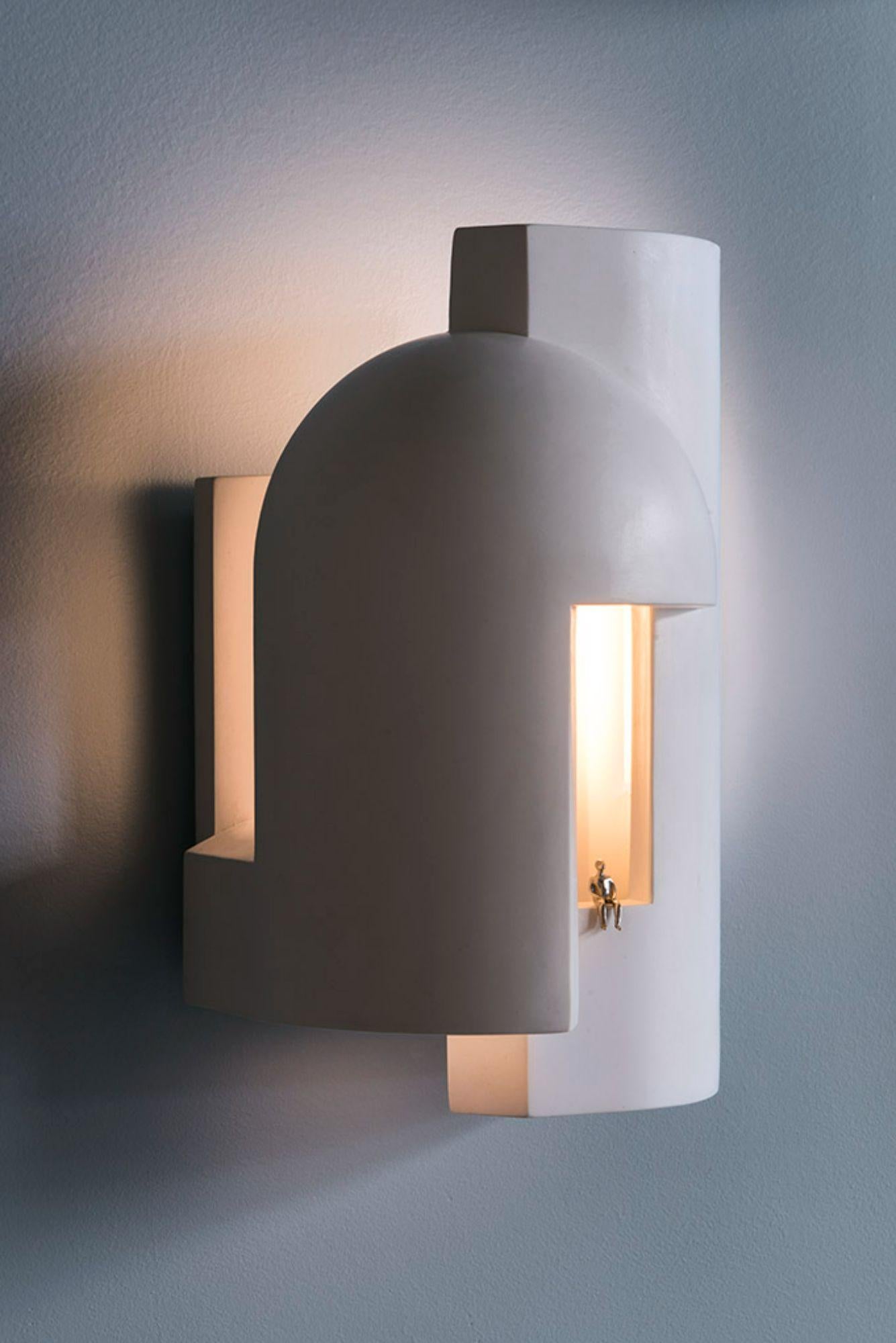 DCW Editions Soul Story 1 Wall Lamp in White and Gold Leaf by Charles Kalpakian
 
 Plaster lamp intended as wall lamps and designed to be scrutinised as if entering a dark alley at dusk and suddenly being pierced with a surreal ray of light.
 A