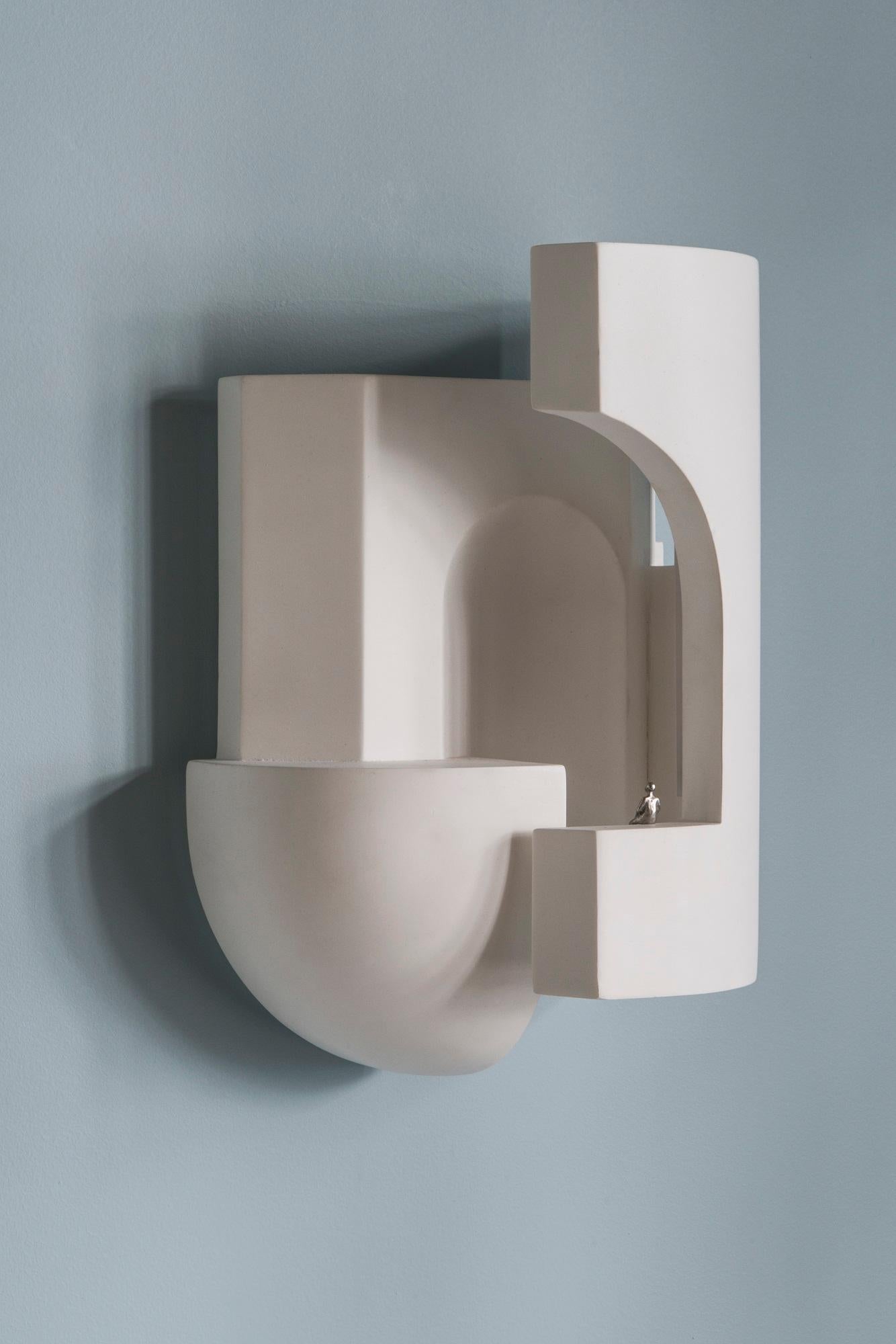 DCW Editions Soul Story 2 Wall Lamp in White Plaster by Charles Kalpakian
 
 Plaster lamp intended as wall lamps and designed to be scrutinised as if entering a dark alley at dusk and suddenly being pierced with a surreal ray of light.
 A