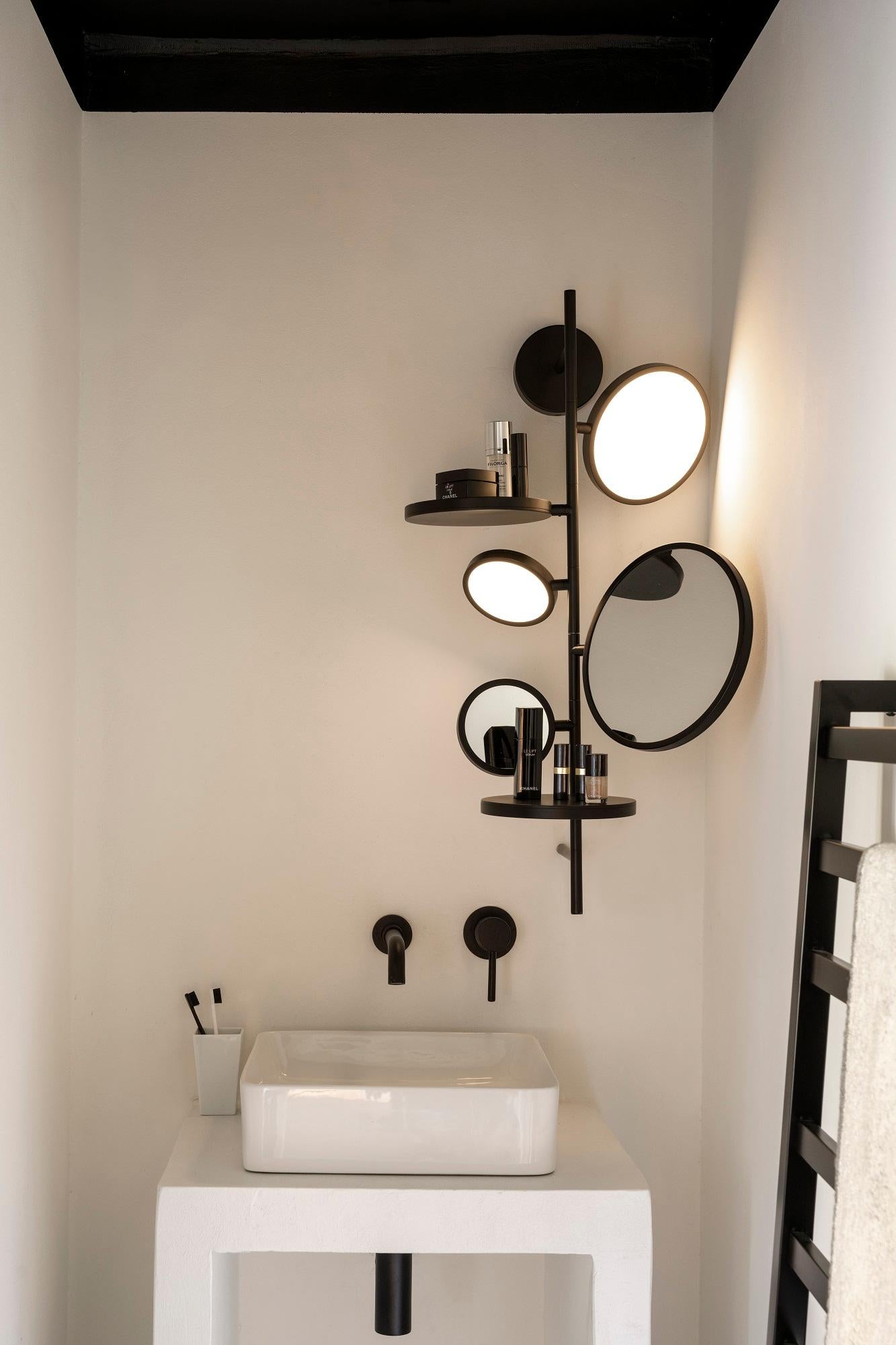 DCW Editions Tell Me Stories Mirror Light in Black by Giulia Liverani
 
 To prepare its selfies, to put a smile on its face, to get ready to love itself... Tell Me Stories. This mirror-light has been thought and designed by Giulia Liverani in order