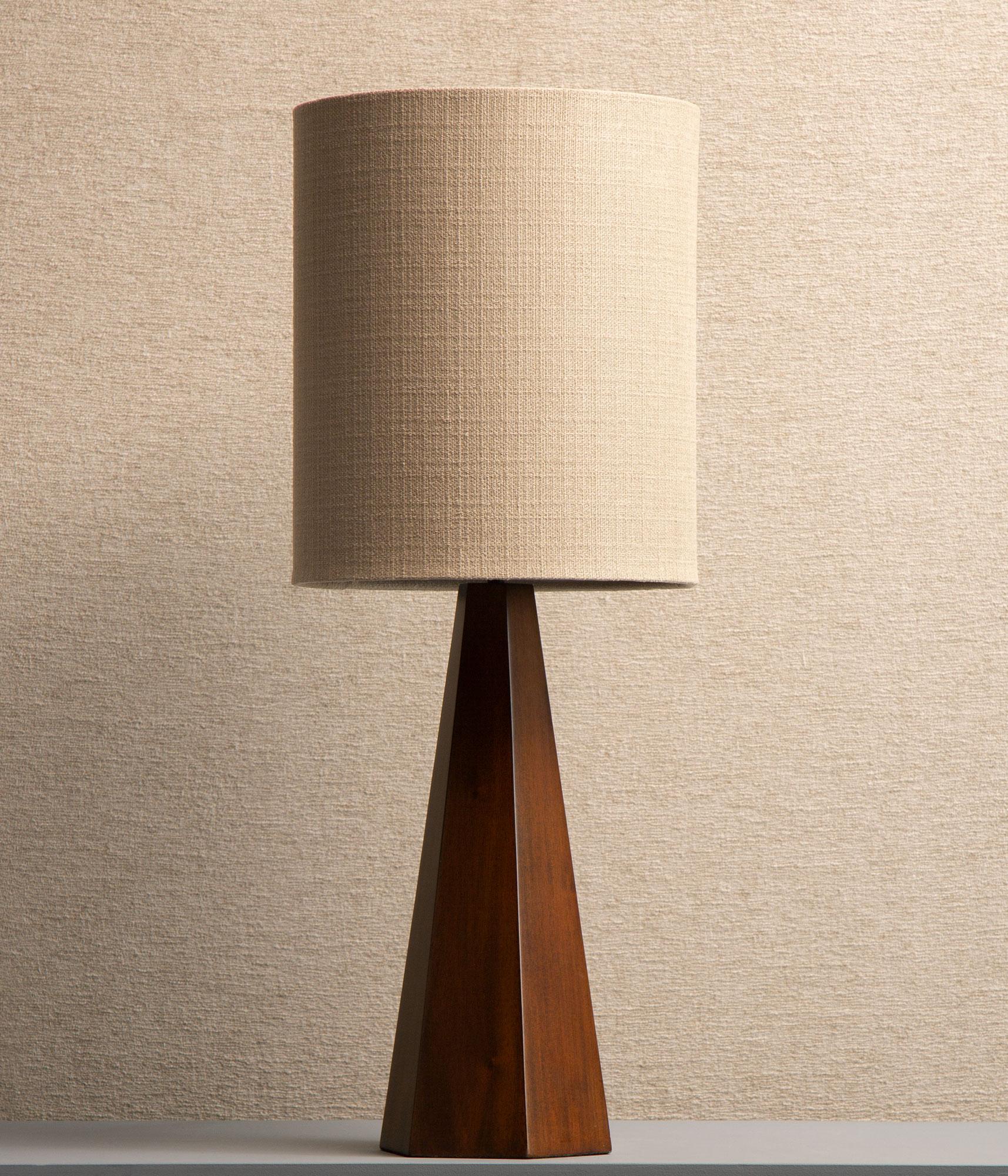 Hexagon shaped lamp base made out of cultivated mahogny, fabric covered shade with diffuser. Two of our favorites shapes come together in this great lamp with a cool 70s vibe. Perfect for the sideboard or nice next to the bed. 

Measurements: H: