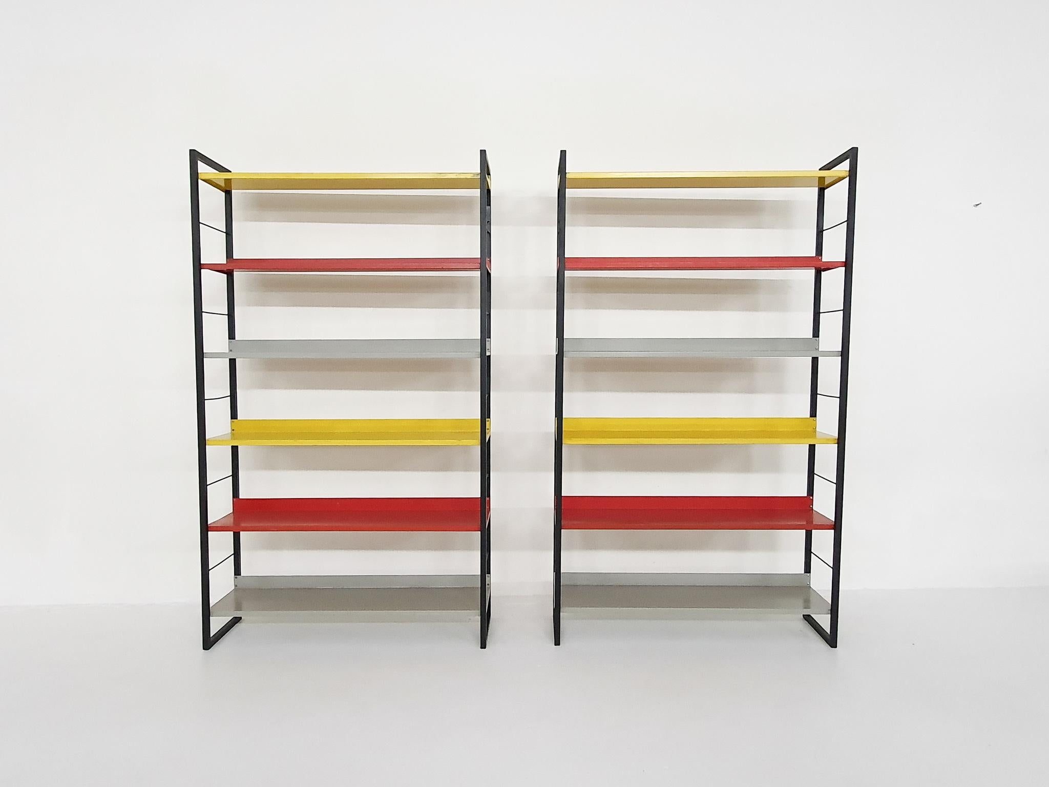 Black metal risers and yellow, grey and red metal shelves.
The yellow and grey shelves have been repianted once ( in original colors)
One cabinet does not have the original screws.

D Dekker
D.Dekker was a designer for Tomado. Tomado was a