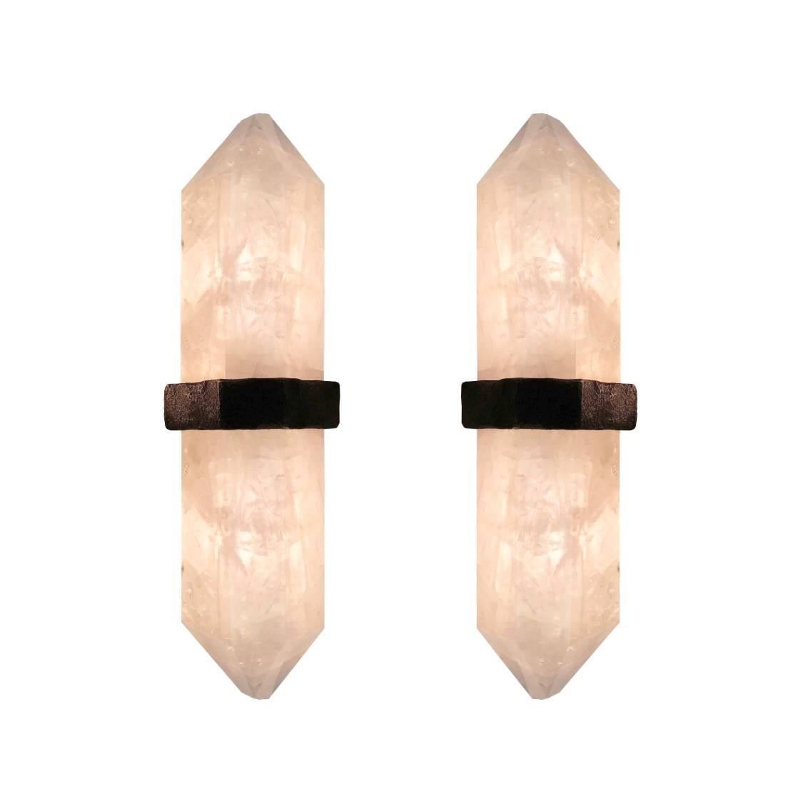 A fine carved diamond form rock crystal quartz wall sconces, mount with rich texture of cast brass decoration, created by Phoenix gallery NYC. Custom size available
Each sconce installed two sockets, and will including two LED light bulbs with 60