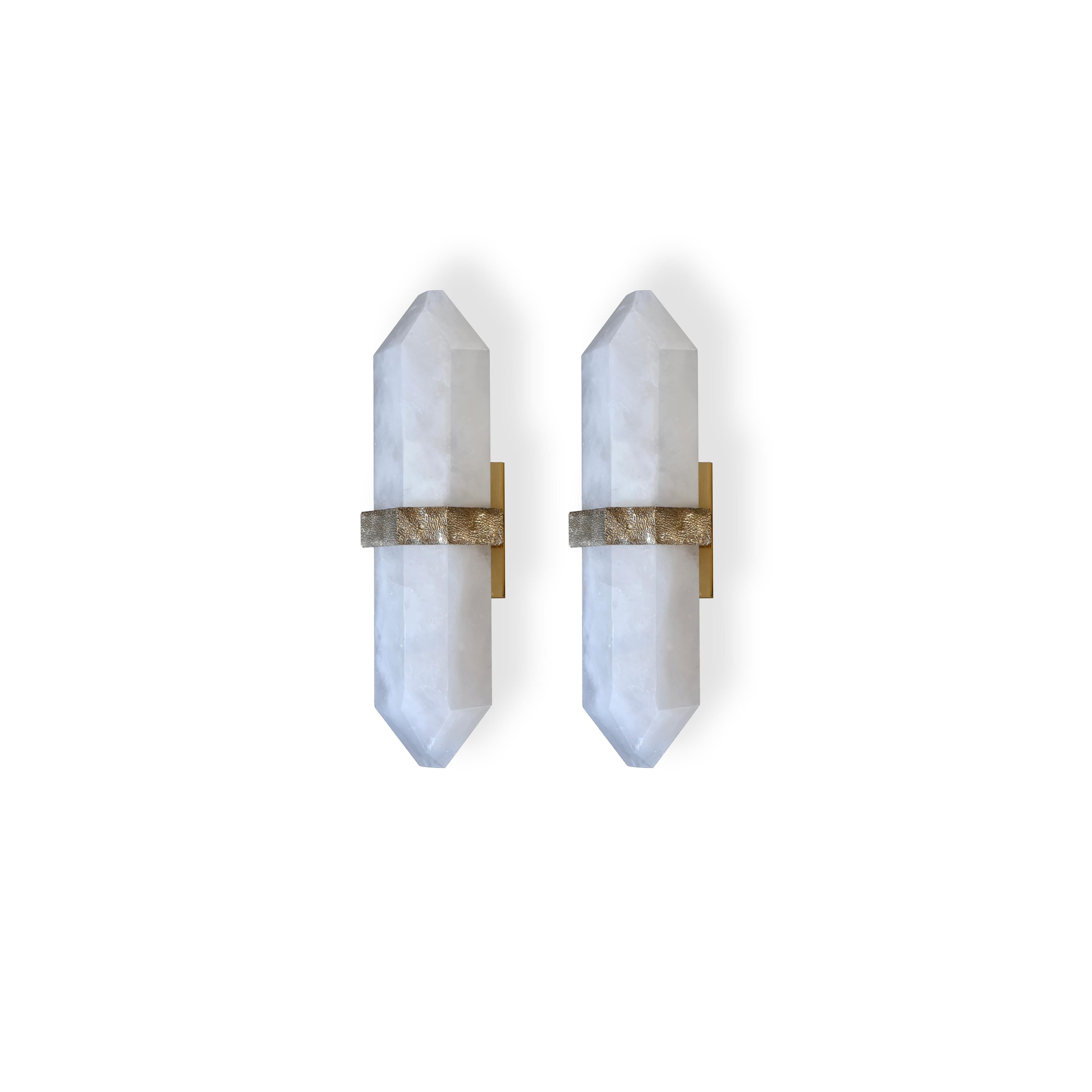 Fine carved diamond form rock crystal quartz wall sconces, mount with rich texture of cast brass decoration, created by Phoenix Gallery NYC. 
Custom size, finish, and quantity upon request. 
Each sconce installed two sockets, and will include two
