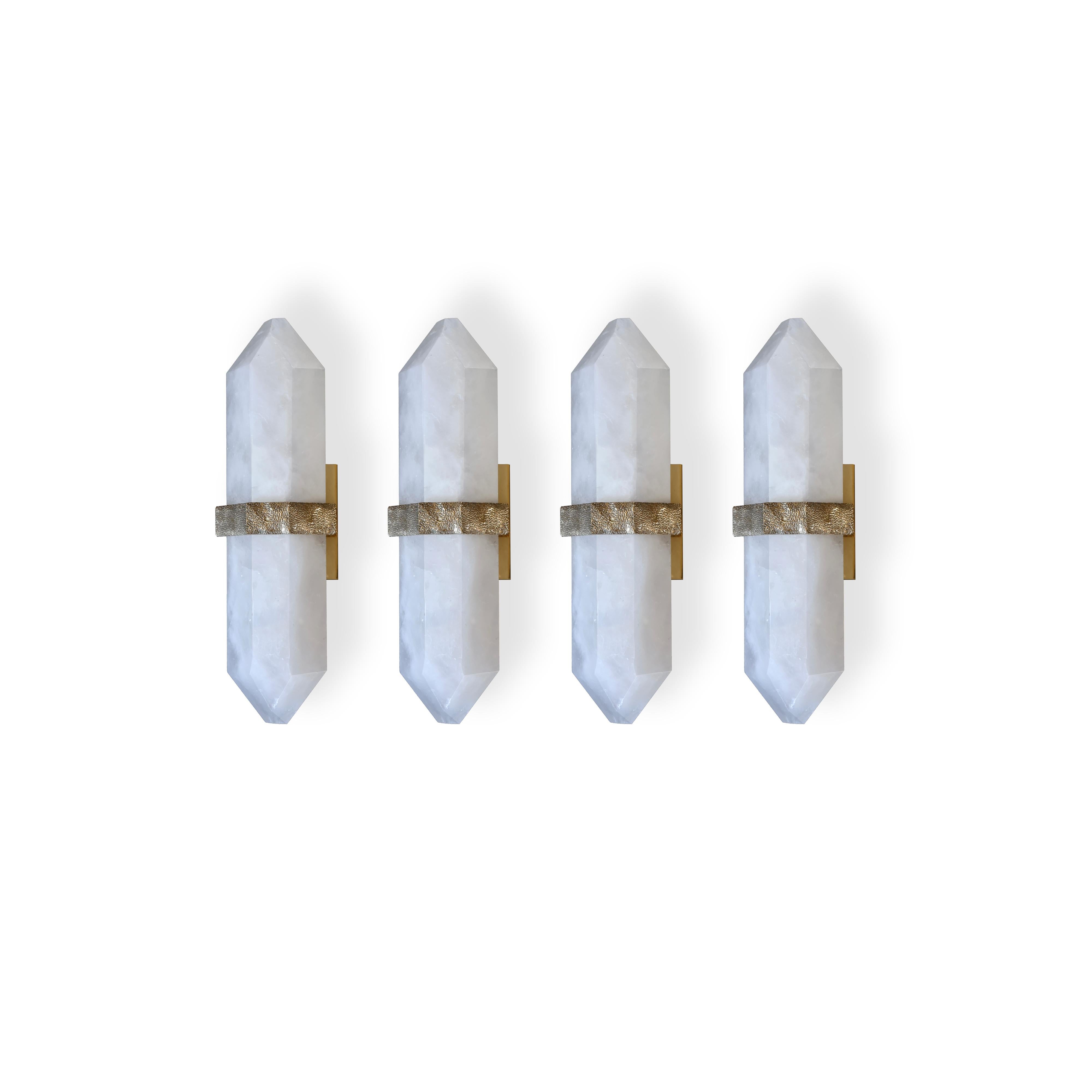 Group of Four fine carved diamond form rock crystal quartz wall sconces, mount with rich texture of cast brass decoration, created by Phoenix Gallery NYC. 
Custom size, finish, and quantity upon request. 
Each sconce installed two sockets, and