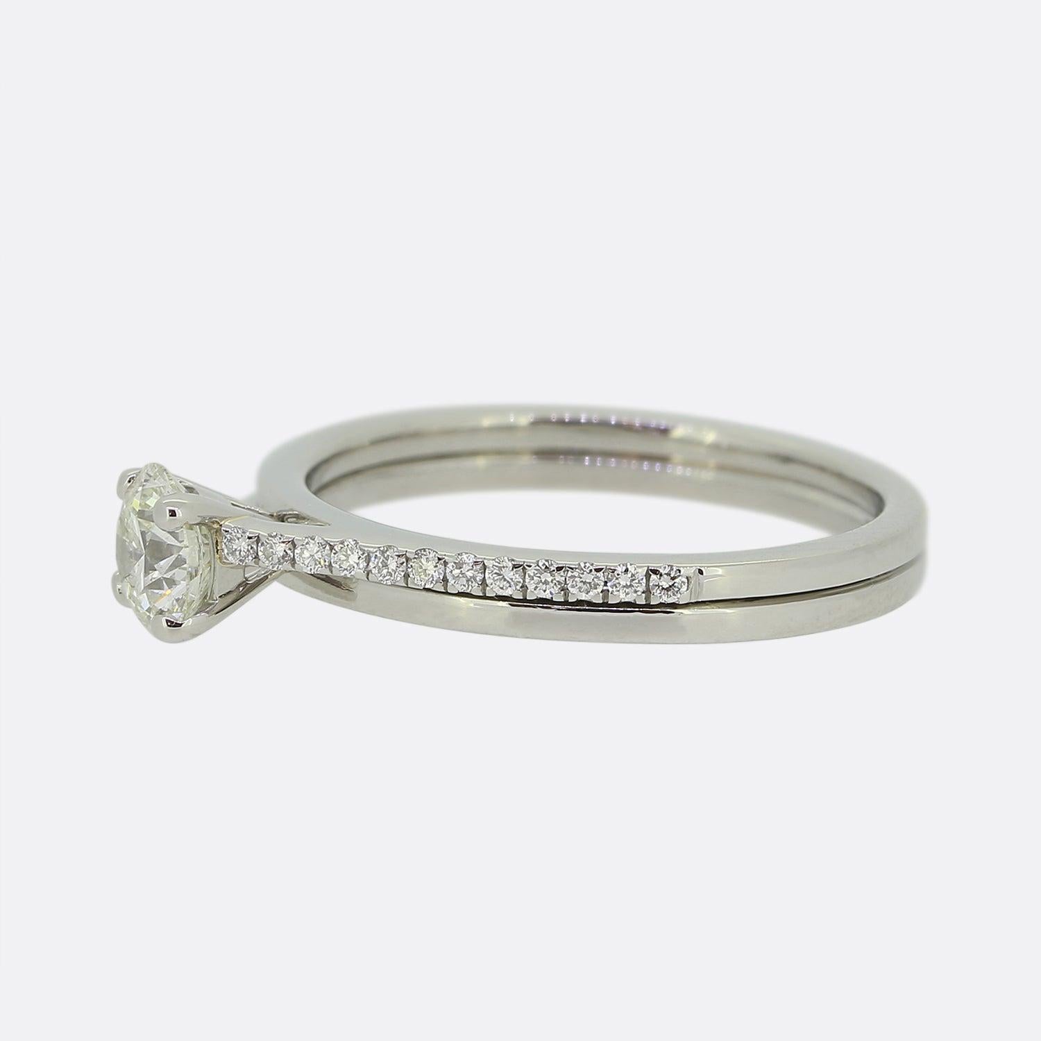 This is a wonderful diamond engagement ring from the luxury jewellery designer De Beers. The ring is the Promise model and features a centralised round brilliant cut diamond that is set in a raised 4 clawed mount. It is an elegant and stylish design